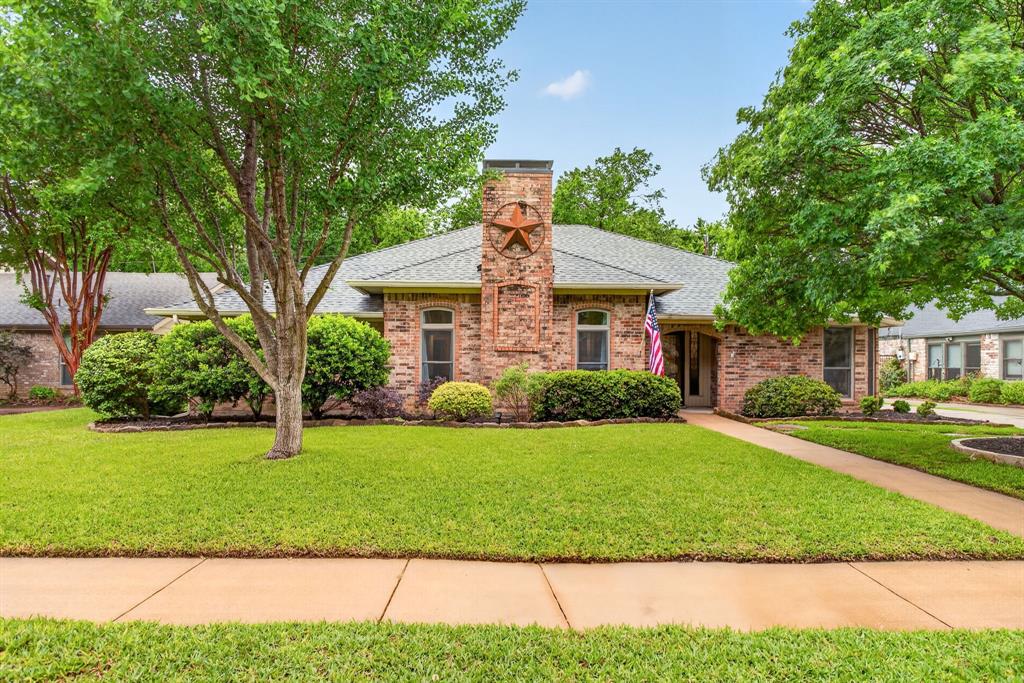 Beautifully updated single-story home in sought-after Creekwood Estates backing to green space with direct access to Bear Creek trails and Parr Park. This 3-bedroom, 2-bath home offers multiple living and dining areas, vaulted ceilings, abundant natural light, and a renovated kitchen that opens to inviting living spaces. Thoughtful upgrades include a custom wine bar, coffee bar, laundry room with custom cabinetry and sink, and built-in entry storage. Enjoy a private backyard oasis with a remodeled landscape, expanded patio, new irrigation, mature trees, and abundant wildlife. Major improvements include a new Carrier 5-ton HVAC system (2026), roof (2020), garage epoxy flooring, garage mini-split, upgraded sliding patio door, and more. Minutes from Downtown Grapevine, Southlake Town Square, Grapevine Lake, DFW Airport, shopping, dining, and Grapevine-Colleyville ISD. Move-in ready.