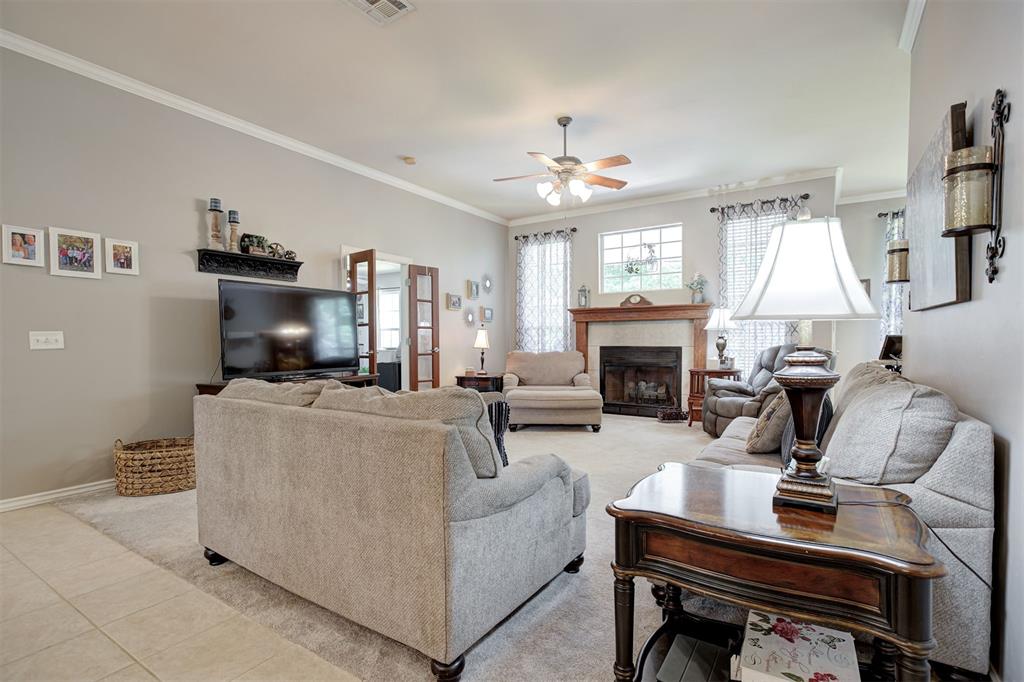 Nestled within a gated community offering a neighborhood pond, playground, pool, and clubhouse, this immaculate one-owner custom home has been thoughtfully designed for both everyday living and effortless entertaining. Filled with natural light and finished in neutral tones, the home features a desirable split floor plan with generously sized bedrooms. A formal dining room with a recessed accent wall provides an elegant space for gatherings, while a private study just off the living room offers the perfect home office or flex space. The inviting living room is centered around a cozy gas fireplace, creating a warm focal point for the home. The spacious kitchen is designed with functionality in mind, offering abundant cabinetry, ample countertop space, a breakfast bar, and a dedicated dining area overlooking the backyard.Step outside to a peaceful retreat where you'll find both an open deck and a covered porch, providing multiple options for entertaining or unwinding. Complete with a charming porch swing, the covered porch is the perfect place to enjoy a quiet morning coffee or relax at the end of the day. The backyard is further enhanced with an in-ground sprinkler system to help maintain the landscaping with ease, while a storm shelter offers added peace of mind. Combining comfort, functionality, and thoughtful amenities, this exceptional home is ready to welcome its next owner.