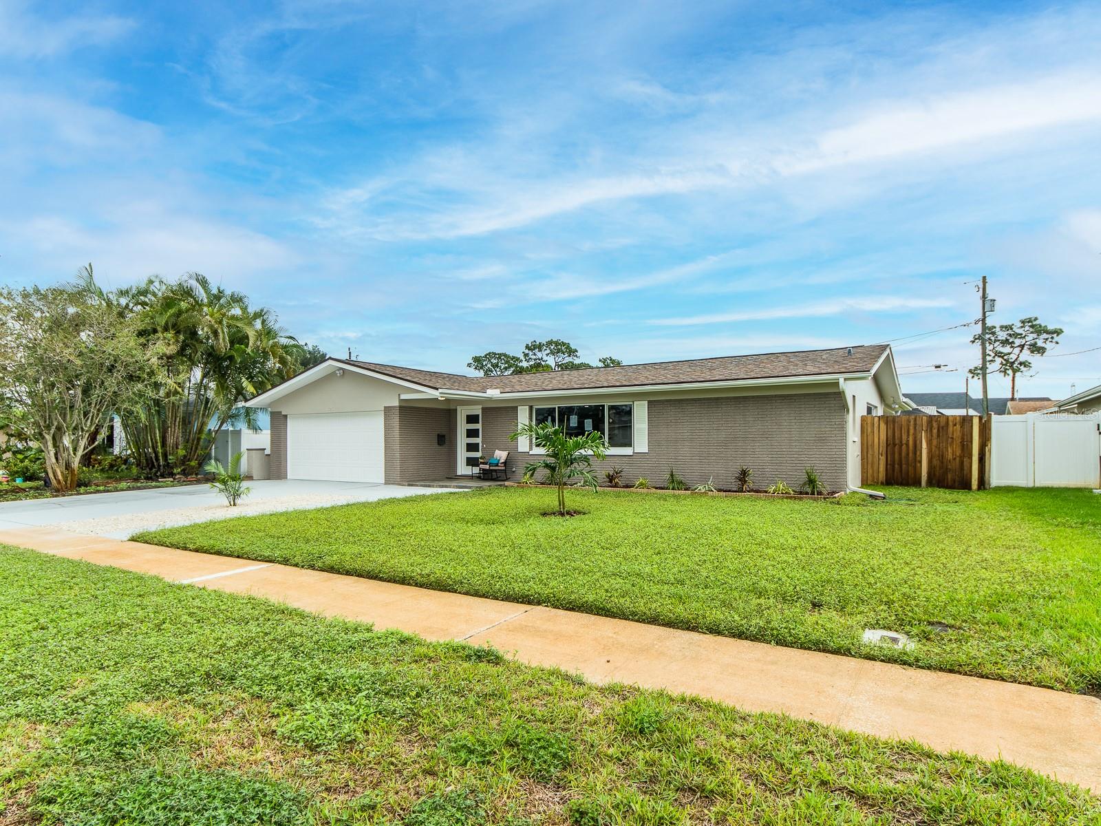 Fresh style meets established Clearwater charm in College Hill! Completely remodeled, this four-bedroom, two-bath home with a two-car garage offers nearly 1,900 square feet of inviting space to gather, relax, and feel at home. Fresh paint inside and out, new interior doors, and luxury vinyl flooring set the stage for a beautifully refreshed interior. The open-concept kitchen takes center stage with all-new white cabinetry, quartz countertops, new stainless steel appliances, and an island that keeps the conversation flowing from meal preparation to entertaining. Enjoy morning coffee or a leisurely evening in the Florida room, offering a versatile space to make your own. Both bathrooms feature all-new cabinetry, while four bedrooms provide room for guests, a dedicated office, or your favorite pursuits. An AC system installed in 2025 and newer double-pane, energy-efficient windows add everyday comfort, complemented by a six-year-old roof and a newer garage door. Outside, new sod gives the yard a fresh start, and a separate storage shed keeps tools and outdoor essentials organized. A beautifully renewed home in a well-established neighborhood—ready for its next chapter!