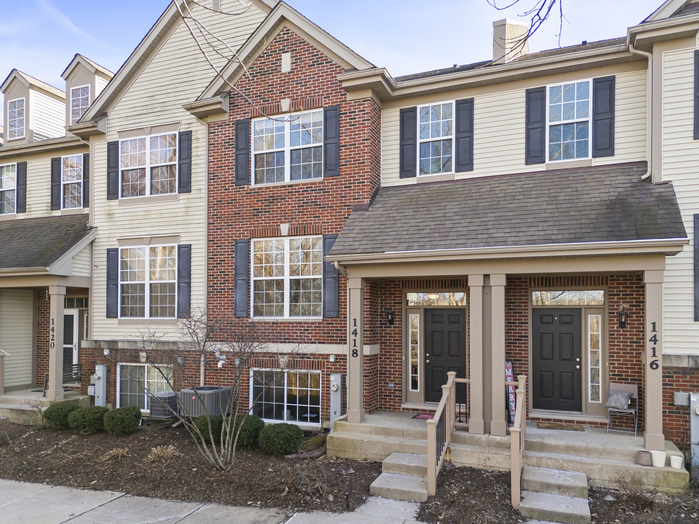 Perfectly positioned with peaceful wooded wetland views from the front porch and living areas, this beautifully maintained three-level townhome offers 2 bedrooms, 2.1 baths, and a functional layout designed for everyday living. The main level features hardwood floors throughout and an open living and dining area that flows seamlessly into the kitchen, which offers generous cabinetry, granite countertops, stainless steel appliances, a pantry, and access to a private balcony - the perfect space to relax. A convenient half bath completes this level. Upstairs, both bedrooms offer private en-suite bathrooms and walk-in closets, including a primary suite with double vanity and soaking tub, while the second bedroom features a full bath with a shower. Laundry is located on the upper level for added convenience. The lower level provides a versatile flex space ideal for a home office, workout room, or guest area and includes an additional storage closet. Significant updates include a stainless steel gas range, built-in microwave, and exterior trim professionally repainted (2025), stainless steel refrigerator and dishwasher (2024), A/C and furnace along with a stainless steel sink, upgraded faucet, and garbage disposal (2023), and a kitchen refresh with new paint, subway tile backsplash, and washer and dryer (2022). Additional highlights include ample closet space throughout and a two-car attached garage. Conveniently located near shopping, parks, schools, and expressway access. A move-in ready home offering thoughtful improvements, functional living space, and a peaceful wooded setting.