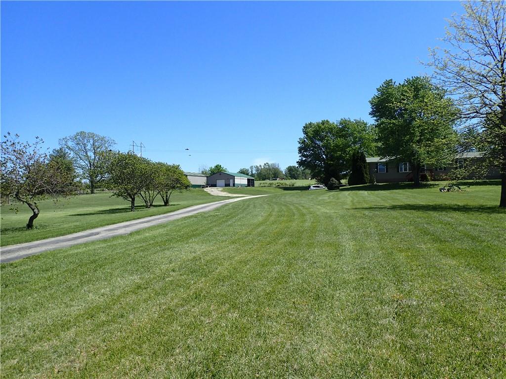 Yearning for life in the country, maybe a few chickens for fresh eggs, a horse for the kids, a nice area to retire?  Take a look at this ranch home that sits on right at 5 acres, with a 1200 sq ft out building.  The main level of this home is 1863 sq ft, with an unfinished 1863 ft basement great for a large workshop and has a tandem garage side.  This home does need updating with interior paint and carpet and some repairs and the home is being sold "AS IS".  The sale and closing of this home are contingent on court order approval. All offers considered.