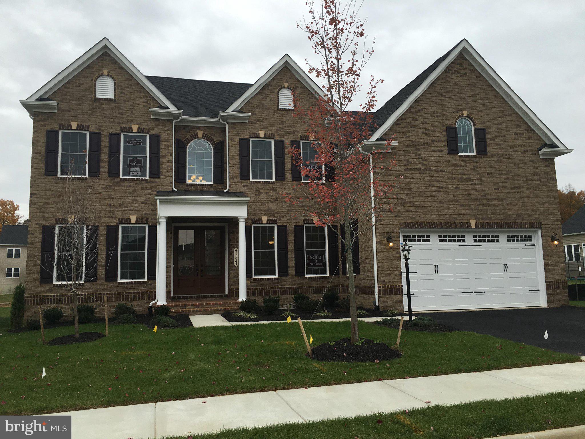 Welcome to 41523 Cross Canter Dr, an exceptional northeast-facing residence offering 6 bedrooms, 5.5 bathrooms, and beautifully designed living space on a premium lot in sought-after Aldie. From the moment you arrive, this home makes a striking impression with its dramatic two-story foyer, elegant staircase, rich hardwood flooring, refined formal living and dining rooms, and upscale architectural details throughout.The main level is designed for both everyday comfort and stylish entertaining, featuring a desirable private guest or in-law suite with an attached full bath, a soaring two-story family room with a cozy gas fireplace, and a stunning gourmet kitchen at the heart of the home. Highlights include an oversized extended island, abundant cabinetry, spacious pantry, premium finishes, and a bright morning room that opens seamlessly to the outdoor living area. A whole-house water filtration system adds everyday convenience and value.Upstairs, the luxurious owner’s suite serves as a private retreat with tray ceiling detail, dual walk-in closets, and a spa-inspired bath complete with a jacuzzi tub, separate glass-enclosed shower, and dual vanities. Generously sized secondary bedrooms, including a private ensuite, provide flexibility and comfort for family and guests.The fully finished permitted lower level offers outstanding versatility with its own separate private entrance, making it ideal for extended family, guests, or multigenerational living. This level includes a spacious recreation and media area, a private bedroom, two full bathrooms, a kitchenette, and its own washer and dryer, creating a rare and highly functional living space with exceptional privacy and independence.Step outside to an impressive fully finished backyard retreat featuring a large patio, gazebo, and outdoor fireplace—perfect for entertaining, relaxing, and enjoying outdoor living at its finest. This remarkable home offers the perfect blend of elegance, comfort, space, and flexibility in one of Aldie’s most desirable locations