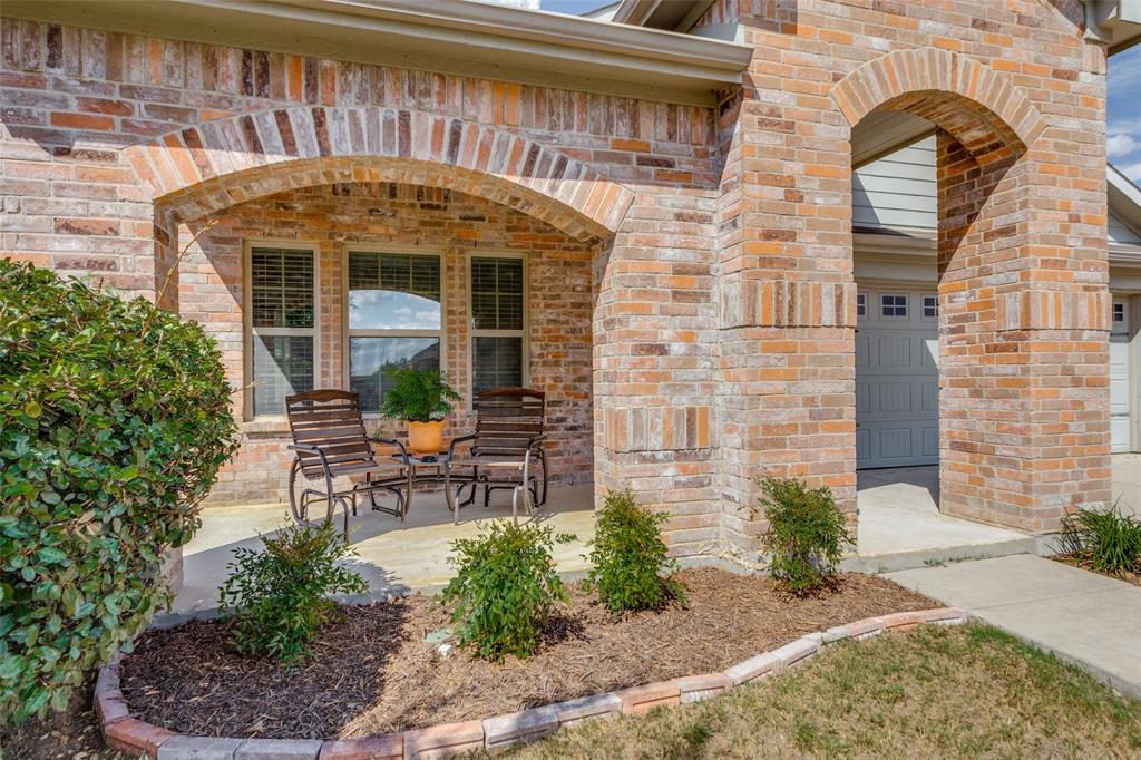 Charming 4-bedroom 2 bath brick home on corner lot with gorgeous curb appeal, inviting front porch and a welcoming entry to this open floor plan with soaring ceilings, sun-filled neutral palette and wood like tile flooring throughout all living areas. Spacious kitchen with walk-in pantry and laundry. SS appliances, island and bar open to large living and dining room. Move-in ready! Enjoy community pool, quick access to I-35 and tons of nearby shopping.