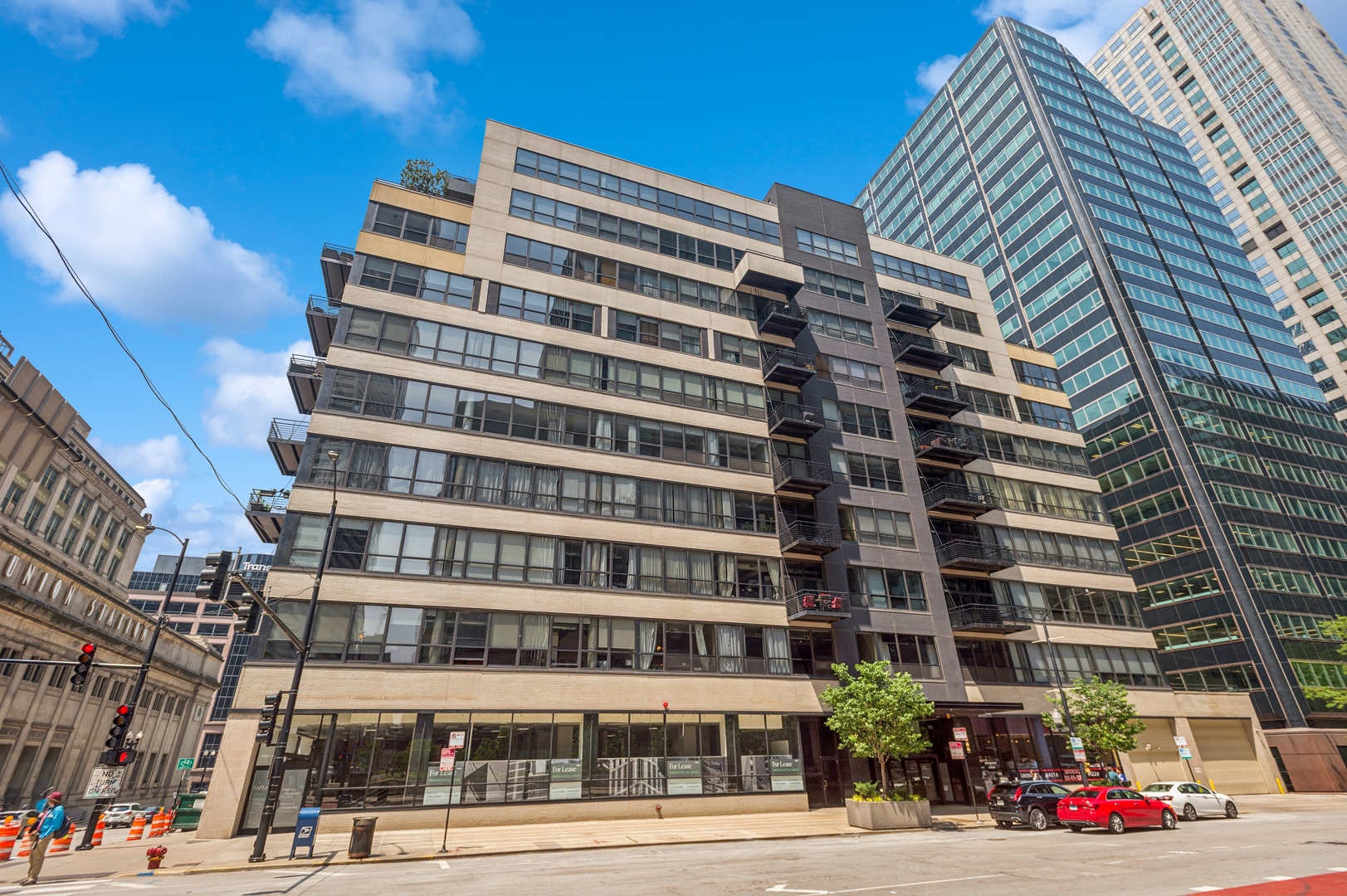 Discover modern elegance at 130 South Canal Street, Unit 210, a stunning 1-bedroom, 1-bath condo boasting 860 square feet of luxurious living space. BRAND NEW Hardwood Flooring throughout the entire condo with newly painted interiors creates a bright and inviting atmosphere. The brand-new dishwasher and refrigerator complement the granite kitchen counters and maple cabinets, making it perfect for entertaining. Relax in the open living area with 11ft high ceilings and a cozy fireplace, perfect for unwinding. The spacious bedroom offers a walk-in closet, while the in-unit washer and dryer add convenience to daily life. Enjoy outdoor moments on your 24 x 12 private patio, and take advantage of the building's amenities, including a gym, bike room, storage and common rooftop deck.  Benefit from the doorman, elevator access, and heated garage parking included with automatic door in the secure attached parking area.  Ideally located in the Financial District, this pet-friendly residence offers easy commutes to nearby universities and major venues, with Metra commuter stations close by for convenient travel between the city and suburbs. Also Investor friendly!