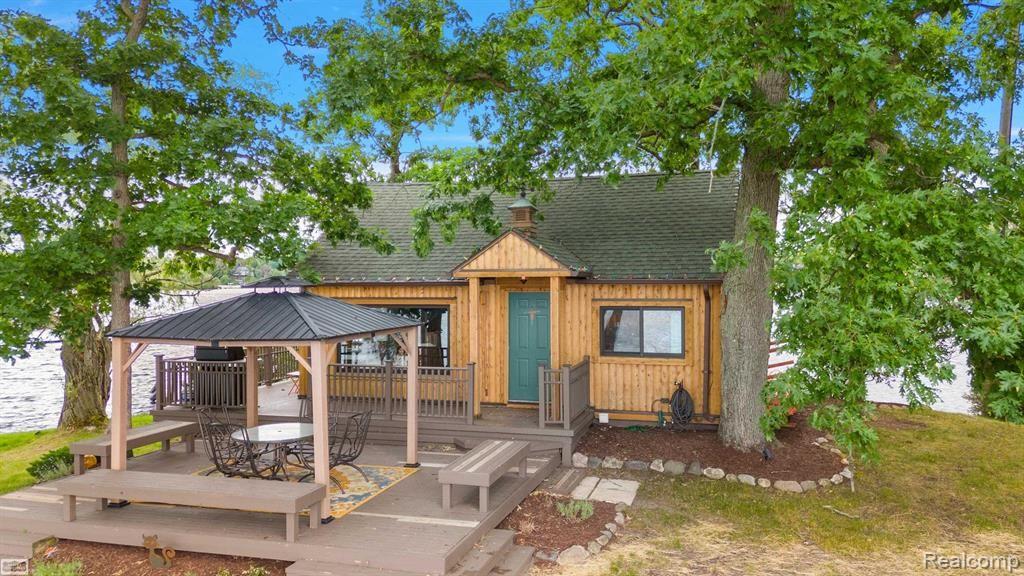 This listing is for an ISLAND with a GORGEOUS 360 LAKEFRONT HOME: YOUR PRIVATE RETREAT ! SURROUNDED BY  SANDY BEACH, ENJOY YOUR OWN YEAR ROUND VACATION DESTINATION! HAVE WAVES OF FUN ALL WATER SPORTING, BOATING. FISHING ETC! BUY NOW AND ENJOY THE REST OF THIS SEASON ON THE LAKE AND IN THE WATER! OPEN FLOOR PLAN BOASTS HARDWOOD, TILE & GRANITE, GORGEOUS BUILT-INS FOR TONS OF STORAGE. A GREAT HOME FOR ENTERTAINING FAMILY & FRIENDS WITH ROOM FOR LARGE GATHERINGS. ENJOY SPECTACULAR SUNSETS AROUND THE CAMPFIRE AFTER A FUN-FILLED DAY ON THE LAKE. BEAUTIFUL AREA WITH MANY GOOD FISHING SPOTS, ROOM FOR ALL YOUR TOYS. TRULY AN OASIS~ A NO-WORRIES-JUST-MOVE-IN-READY-EVERYTHING NEW- DREAM-GET-A-WAY HOME! ONLY A FEW MINUTES AWAY~STROLL CLARKSTON OR DAVISBURG-SMALL TOWN LOOK WITH ALL THE AMENITIES. AWARD WINNING RESTAURANTS, TOP-NOTCH SCHOOLS, STATE OF THE ART LIBRARY, SHOPS, GOLF, CONCERTS, SERVICES.  VIBRANT COMMUNITY HOSTS MANY FESTIVALS, EVENTS HELPING DEFINE THIS WONDERFUL QUALITY OF LIFE!  The island is also being offered with a buildable vacant lot on Dixie Hwy: MLS# 20250000114.  Purchaser: All Info Not Guaranteed, Independently Verify.