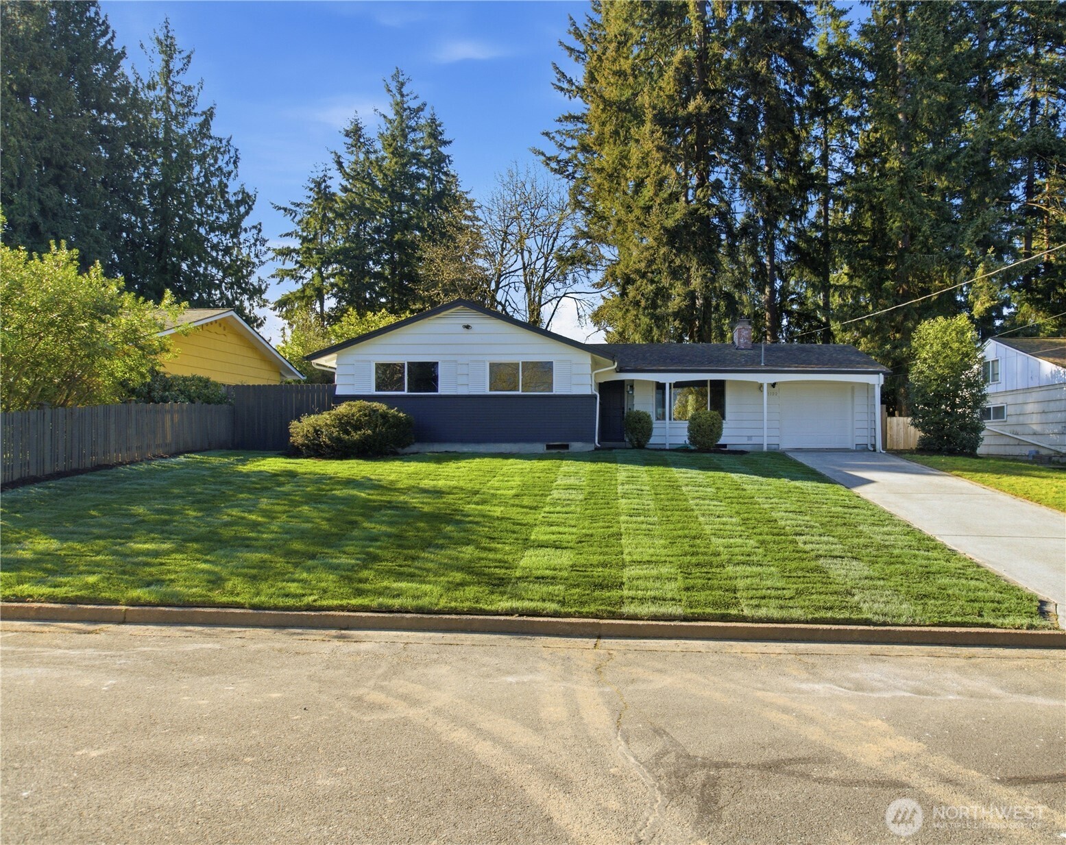 Beautifully remodeled 3-bedroom, 2-bath home offering 1,200 sq ft of thoughtfully designed living space. This turnkey property features a stunning new kitchen with quartz countertops, custom cabinetry, and stainless-steel appliances, complemented by designer tile work throughout the kitchen and bathrooms. Warm engineered white oak flooring flows seamlessly across the open-concept, single-level layout, creating a clean, modern feel ideal for both everyday living and entertaining. Step outside to a private, serene backyard framed by mature evergreen trees, providing a peaceful retreat with plenty of space to relax or host. Located in a highly sought-after scenic hill setting, offering both privacy and convenience.