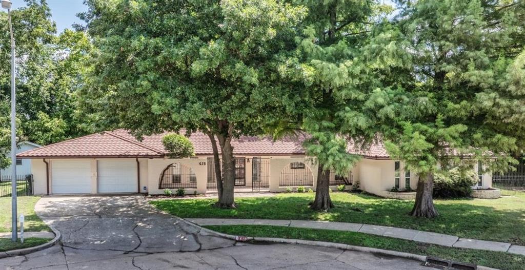 Welcome to this beautifully updated home nestled on a quiet **cul-de-sac**, offering comfort and convenience. This spacious 4-bedroom, 2.5-bath residence features a **2-car garage** with an **in-ground storm shelter**, plus a meticulously maintained courtyard surrounded by **mature trees** for added privacy and charm.Step inside to discover thoughtfully selected upgrades, including **updated LVP flooring**, **refinished hardwood flooring**, and updated **interior paint**. The galley kitchen offers **double ovens**, **stainless steel appliances**, ample cabinetry, and pantry spaces. Additionally there is abundant **built-in storage** found throughout the home in several bedrooms and in the study. A dedicated **study/office** provides the perfect space for working from home.The luxurious primary suite offers a spa-like retreat with **dual sinks**, a **jetted tub**, and an expansive **walk-in shower** featuring **body jets**, a **rain shower head**, and a **handheld sprayer**.Additional highlights include a striking **Spanish-style metal roof (2018)**, **dual-zone HVAC**, a **whole-home generator** with maintenance records, and **updated plumbing** updated electrical panel**, ensuring peace of mind for years to come. The backyard is an outdoor oasis with **lush grass**, a full **sprinkler system**, **mature trees**, and **two storage buildings**—perfect for hobbies, tools, or extra workspace.This property seamlessly combines modern upgrades with timeless appeal—don’t miss your chance to make it your next home!