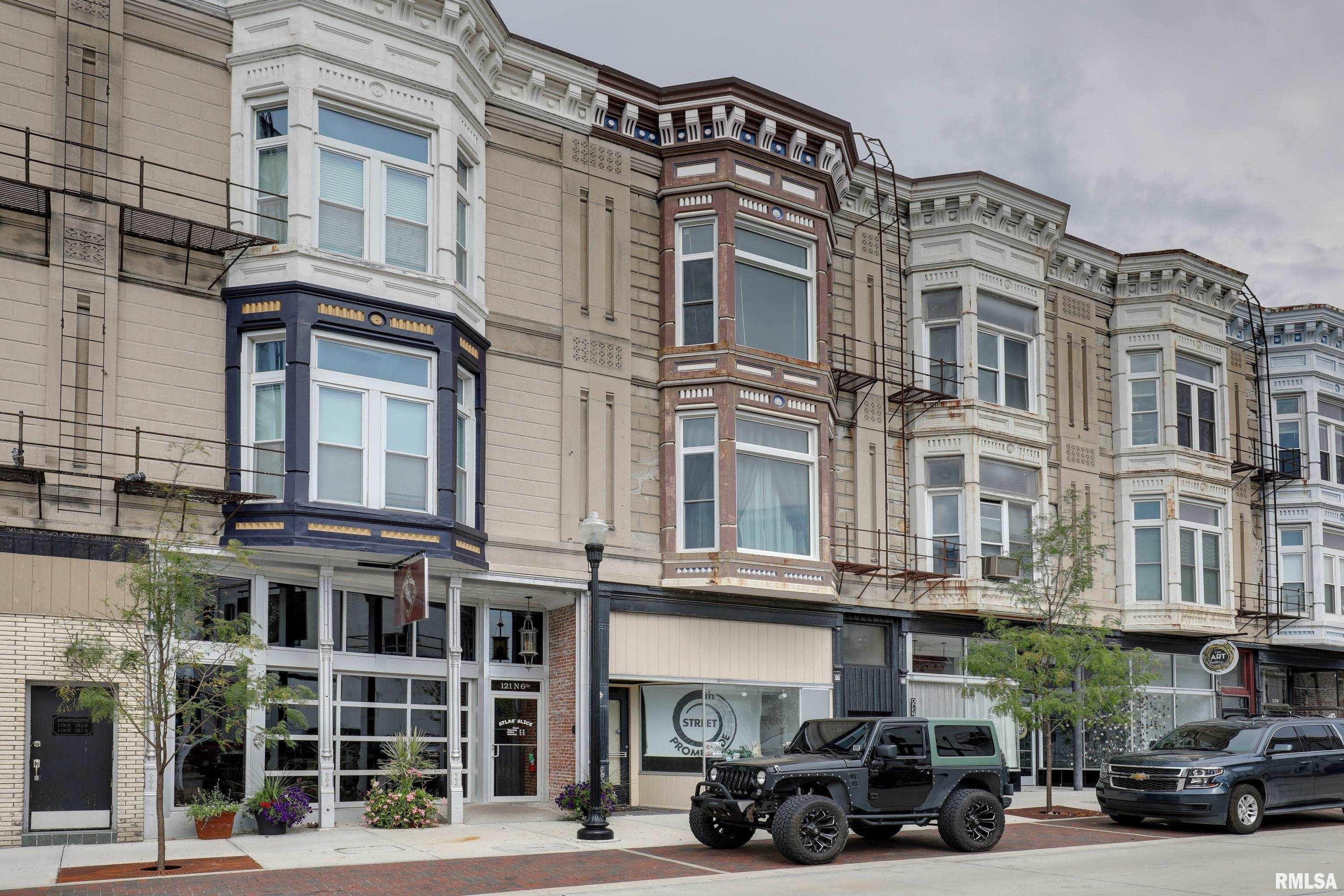 Position your investment at the heart of Quincy’s thriving 6th Street Promenade with this exceptional mixed use property offering unlimited potential. As the last remaining unfinished commercial storefront on the Promenade, this is a rare opportunity to design a business space tailored to your vision in one of downtown’s most sought after destinations. Above the commercial space are 2 luxury apartments, each offering 2 bedrooms and 2 full bathrooms. Gutted to the studs and meticulously rebuilt in 2020, both residences feature all new plumbing, electrical, HVAC systems, windows, drywall, flooring, and beautifully designed custom kitchens with high-end finishes throughout. An expansive open air deck added in 2018, creates an inviting outdoor retreat rarely found in downtown living.  Whether you’re looking to operate your business or an investor seeking a turnkey mixed use asset, this property offers remarkable flexibility. The residential units have demonstrated exceptional rental demand. Located in the heart of Quincy’s vibrant 6th Street Promenade surrounded by popular restaurants, breweries, shopping, entertainment, and year round community events this is an opportunity to own a premier downtown property with strong existing income, a commercial space, and long term appreciation potential. Opportunities like this are exceptionally rare. Bring your business, expand your portfolio, or do both all from one of downtown Quincy’s most desirable addresses!