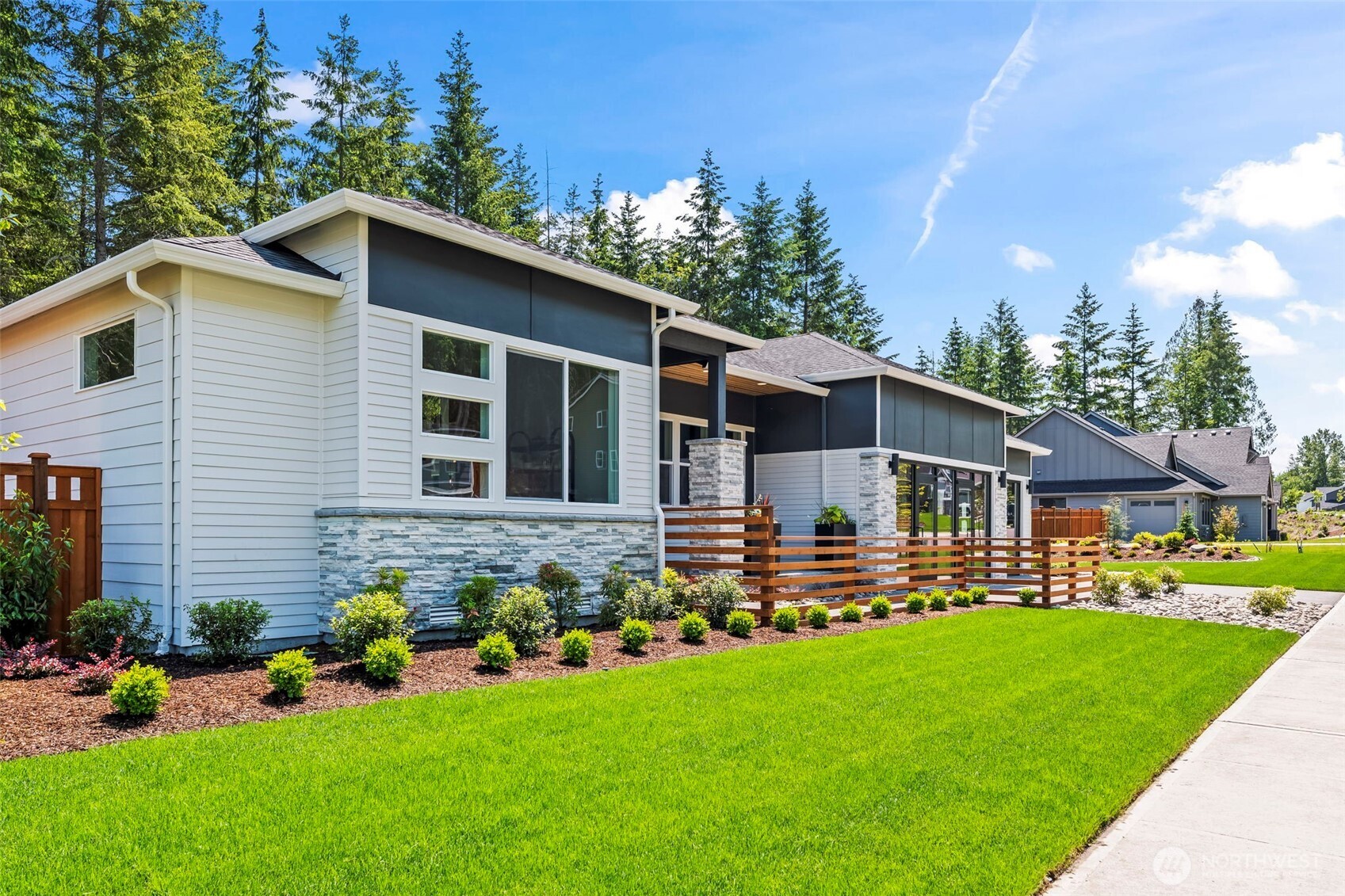 Discover luxury living in this stunning Shasta Daylight Basement model home by Garrette Homes, located in the coveted Glacier Pointe enclave of Tehaleh. Set on a generous .35-acre homesite, this property offers exceptional privacy and a peaceful, quiet setting surrounded by nature. Thoughtfully designed for modern living, the home showcases upscale finishes, expansive living spaces, and seamless indoor-outdoor flow. The daylight basement provides versatile space ideal for entertaining, recreation, or multi-generational living. Step outside to your private sports court, creating the ultimate backyard retreat for play and gatherings. Built with the signature craftsmanship and luxury detailing Garrette Homes is known for, this exceptional model home offers refined living near Tehaleh’s miles of trails, parks, and community amenities.