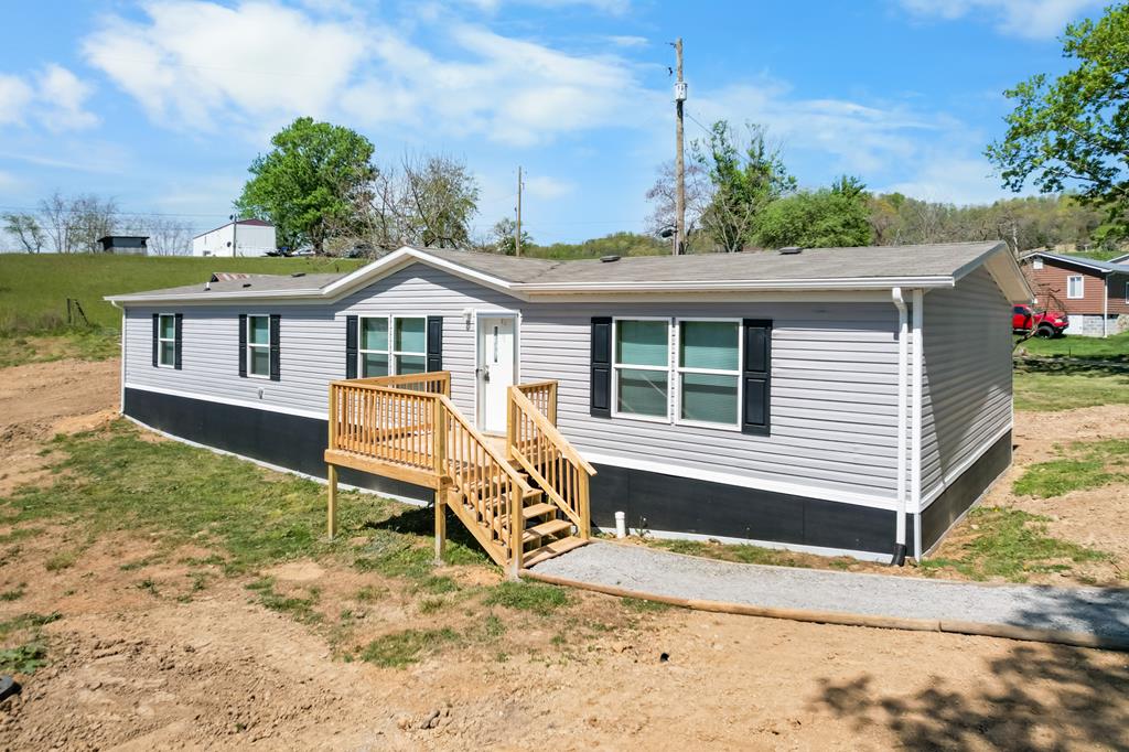 Lots of space! Featuring 2030 sq ft, 4 bedrooms 2 full baths, dining room, living room and family room, laundry room and spacious kitchen. Great location on a quiet street near South Holston Lake.  Situated on 2.01 acres. There is a 20 ft right of way through the property from Neal Rd to Lot number 2,  See survey in MLS docs.  The septic system is conditional for a three bedroom dwelling.  No more than 6 occupants are allowed.  Septic docs can be found in the MLS docs. Proof of funds or pre approval letter must accompany all offers. Come take a look!