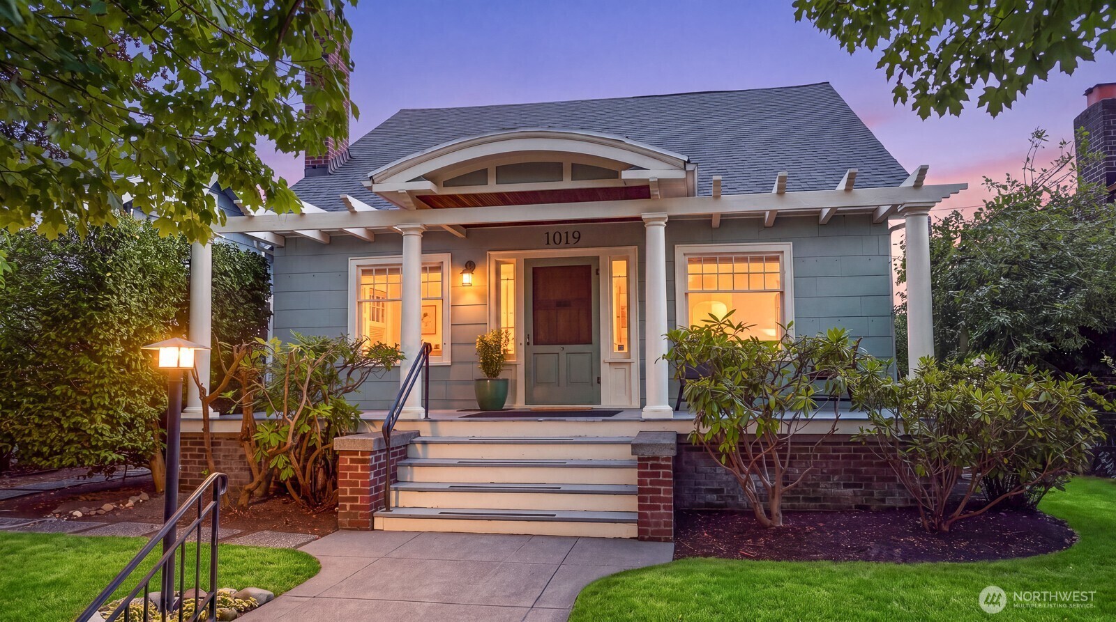 Welcome to this charming Roosevelt bungalow located in one of Seattle's popular neighborhoods. Built in 1918, this home features beautiful architectural details; refinished hardwood and fir floors, arched built-in bookcases, built-in dining room hutch, etched sidelights and vintage light fixtures all add to the charm. Updates include: gas fireplace, HVAC for air conditioning, updated bathrooms, updated kitchen including a Fisher Paykel refrigerator. Relax in your private, landscaped backyard of lush green plantings. This 4-bedroom, 2-bath home offers approximately 2,670 square feet of living space and the basement on a 4,992-square-foot lot. All the bedrooms are spacious with good closet space. The primary bedroom can accommodate a king-size bed, sitting area and includes a skylight. The detached garage is accessed through the paved alley. The unfinished basement is clean, freshly painted and ready for your future plans and gas furnace. This charming home is within blocks from: Roosevelt Light Rail station, Green Lake, University of Washington, Roosevelt Square, Whole Foods, Cowen Park/Ravenna Park, There are many local cafes, fitness studios, pet stores, restaurants and more in this great urban neighborhood!