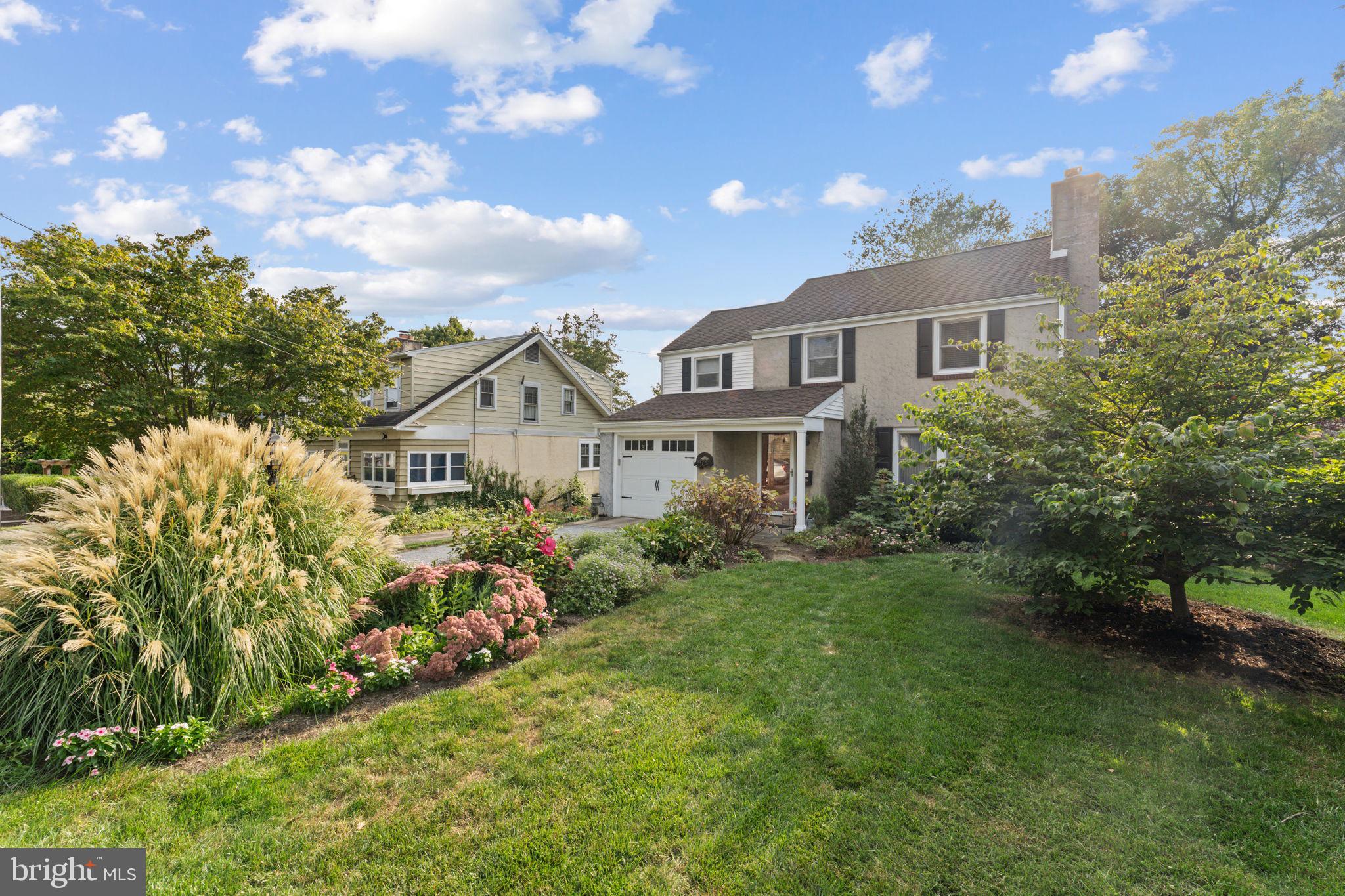 Welcome to 18 Manor Road, ideally located on a quiet street in Paoli and just minutes from the Paoli Train Station, Malvern Borough, and everyday conveniences. This charming 3-bedroom, 2.5-bathroom home is situated in the Great Valley School District and offers a warm, functional layout with timeless appeal. A bluestone walkway leads to the covered front stoop and welcoming entry. Inside, a convenient coat closet sits to the left, while the living room to the right is centered on a classic brick fireplace and enhanced by a large picture window that fills the space with natural light. Hardwood floors extend throughout the home, adding continuity and character. The updated kitchen features cream shaker cabinetry, pantry storage, a dedicated coffee bar, and a pass-through to the expanded dining room. A cozy breakfast nook is nestled between two built-in corner hutches, creating a charming spot for casual meals. The sun-filled dining room offers additional storage closets and French-door access to the spacious rear deck with a retractable awning—ideal for entertaining. From here, step down to the quaint backyard with plenty of room for play or gardening – with a convenient shed for all of your yard tools and games. The main level is completed by a butler’s pantry off the kitchen, a powder room, and access to the attached one-car garage. Upstairs, you’ll find three generously sized bedrooms, all with hardwood floors, served by a full hall bathroom with a tub/shower combination. The partially finished lower level provides additional recreation space, along with a laundry room outfitted with storage cabinetry and access to a second full bathroom with a stall shower. 18 Manor Road is a truly charming home, ready for its next loving owner. Enjoy walkability to San Nicola Restaurant, easy access to Malvern Borough dining, and all that Paoli has to offer.