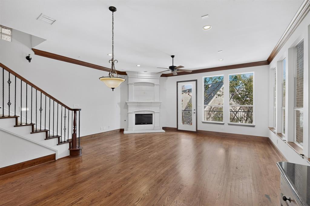 Rare opportunity in a premier gated community! This stunning three-story zero-lot-line home is the only unit in the neighborhood boasting direct access to the community pool, alongside serene lake views and a low-maintenance lifestyle. The first floor welcomes you with a spacious living room featuring warm wood flooring and a door opening directly to a covered patio with immediate pool access. Upstairs, the light-filled second floor is designed for effortless living and entertaining. A wall of windows brightens the family room, anchored by an inviting stone fireplace and opening to a covered balcony overlooking the lake. The gourmet kitchen is equipped with granite countertops, an island with breakfast bar seating, stainless steel appliances with a 4-burner gas range, a walk-in pantry, and generous cabinet storage. The primary suite is a peaceful retreat featuring elegant recessed ceilings, a sitting area, and an en-suite bath with dual vanities, a deep soaking tub, and a separate shower. The well-appointed secondary bedroom includes a walk-in closet and a private en-suite bath. The versatile third floor offers a sprawling game room with custom built-ins and an additional covered balcony—an ideal flexible space for an executive home office, exercise room, or media lounge. Enjoy neighborhood amenities including a community lake and pool. Perfectly situated in acclaimed Plano ISD, close to Brentwood Park and tennis courts, top private and public schools, high-end retail, fine dining, and Bent Tree and Gleneagles Country Clubs. Commuting is seamless with quick access to the Dallas North Tollway and President George Bush Turnpike.
