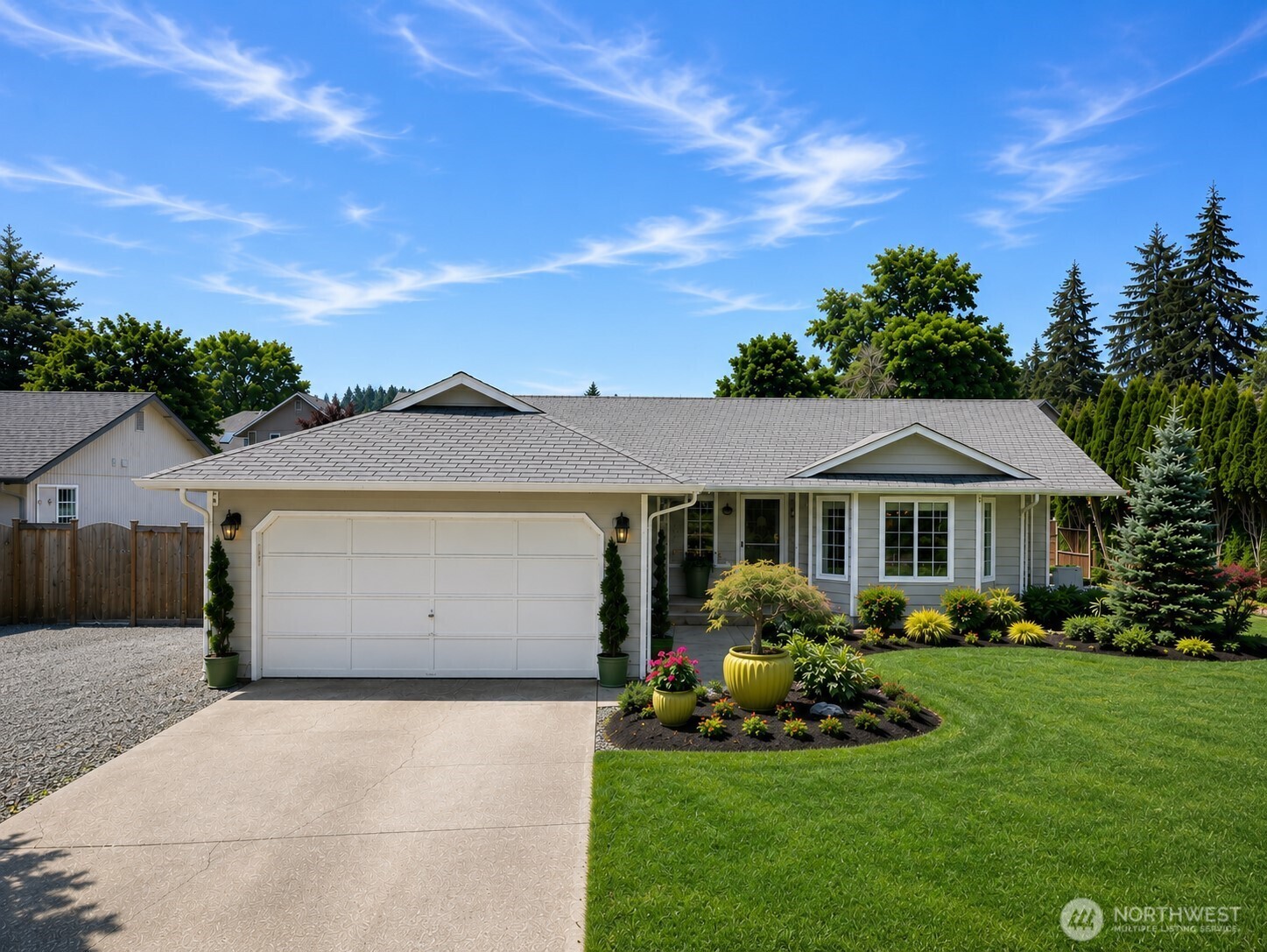 WOW! Don't miss this fully remodeled rambler on a 1/4 acre with RV parking in the heart of Puyallup! This extraordinary single story home offers the perfect balance of luxury living with unbeatable convenience to shopping, restaurants, parks, and quick freeway access. The home has been Meticulously renovated with uncompromising quality including Luxury vinyl plank flooring, a chef's kitchen featuring premium stainless steel appliances, an Italian gas range, granite countertops & custom cabinets.  You'll love the the spacious primary suite with a custom California Closet & a spa like bathroom with a granite wrapped custom tiled shower w/ rain drop head & granite vanity. You'll love the Bluetooth-enabled smart lighting throughout the interior and exterior, as well as an extensive Bluetooth-controlled irrigation system, allowing you to effortlessly manage both your home and professionally designed landscape. Step outside to discover what truly sets this property apart. Years of thoughtful planning and professional landscape design have created an incredible outdoor oasis featuring lush gardens, mature fruit trees, custom lighting, raised planting beds, and a greenhouse. The expansive covered patio spans the full length of the home, providing the perfect setting to entertain, relax in the hot tub & enjoy your private backyard sanctuary. Don't miss the gated RV parking -a rare find- large enough to accommodate both a full-size Class A motorhome and a boat with room to spare!