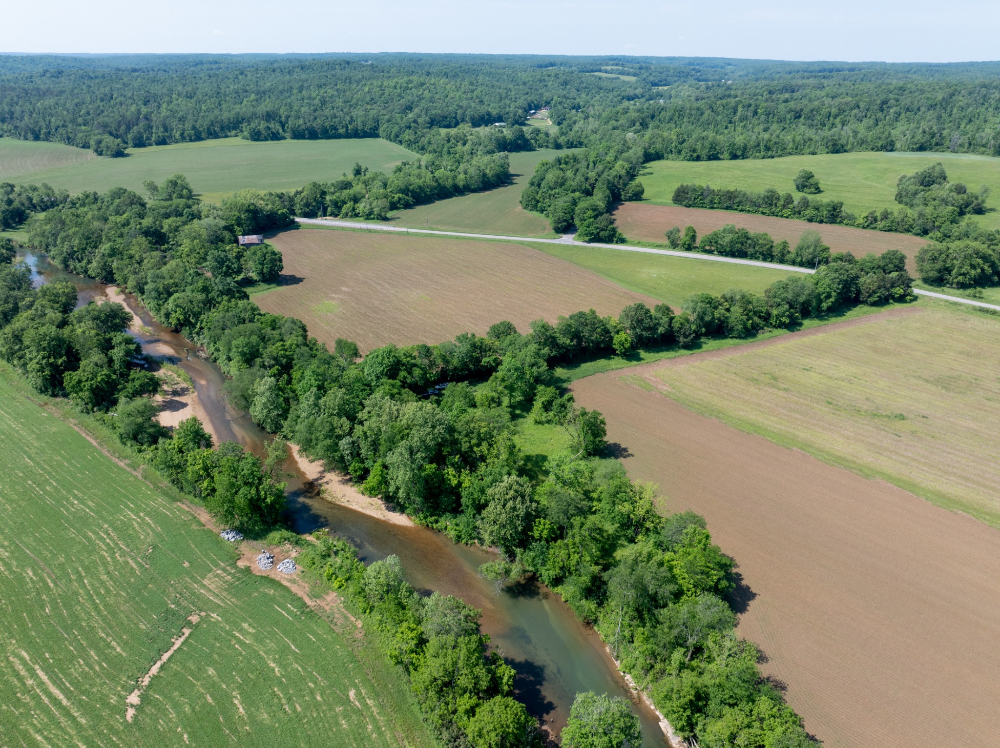 Multi-Generational Farm, the first time EVER on the market!  Prepare to be amazed by this remarkable property, featuring approximately 322(+/-) acres situated along Highway 49 in Erin, Tennessee. Ideally located central to Dickson, Houston, and Montgomery Counties, this land offers the allure of country living while remaining just a short distance from vibrant towns that cater to all your essential needs.Having been a row crop farm for decades, this property embodies integrity and pride, reflecting its rich heritage. The serene Yellow Creek and Salmon Branch flow through the terrain, providing year-round water sources ideal for livestock or family outings. With road frontage along Highway 49, Salmon Branch, and Bethany Road, this unique property offers the potential for a family commune with multiple inviting entry points.New Survey in Docs. Check out the three sub-listings now; 1 Hwy 49 (159+/-acres): MLS#2888466, 2 Hwy 49 (123+/- acres): MLS#2888490, 3 Hwy 49 (32+/-acres): MLS#2888497
