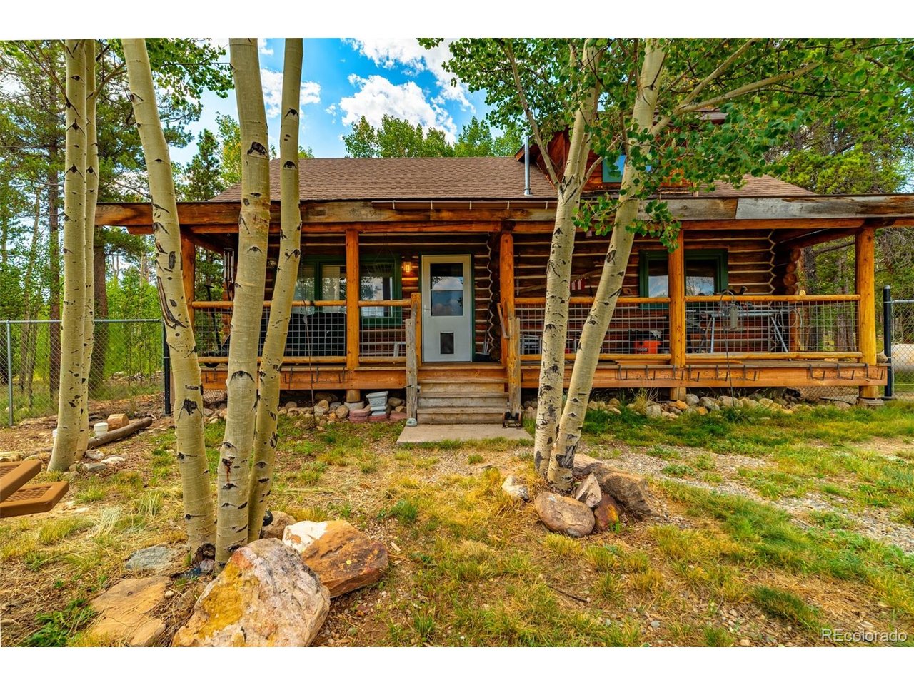 Charming full-round log cabin nestled among a beautiful grove of aspens and evergreens. Enjoy privacy and sunshine on this level, flat 2-acre lot, conveniently located just 1.5 miles from pavement. The cabin features vaulted ceilings and new rustic hickory kitchen cabinets that beautifully complement the warm mountain character of the home. Electric baseboard heat, a propane wall heater, and a wood-burning stove provide multiple heating options. Natural gas is available at the driveway entrance. A new fully fenced 5-foot area provides a perfect space for pups to roam. The 2-bedroom septic system is currently in the process of inspection. Located in Foxtail Pines, where residents enjoy access to a community area with private fishing. A peaceful mountain retreat with the convenience to enjoy the nearby trails of the National Forest Service and World Class skiing at Breckenridge!