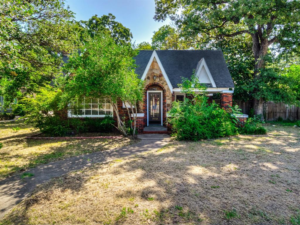 Built in 1931, this charming single-story home blends timeless character with thoughtful updates, offering a warm and inviting space that feels light, bright, and full of life. Natural light pours in through an abundance of windows, creating a cheerful atmosphere in every room while highlighting the home’s original architectural details. The kitchen is designed for both function and style, complete with granite countertops, stainless steel appliances, and a gas range that makes cooking a joy. A full-size laundry area is located just off the kitchen, providing everyday convenience. For meals, you’ll find a formal dining room that’s perfect for hosting special occasions, as well as a cozy breakfast room—an ideal spot for quiet mornings with a cup of coffee. Sitting on a large corner lot, the home offers generous outdoor living space. A patio comfortably seats six, making it an excellent place to unwind or entertain family and friends. The detached garage includes a built-in work area, perfect for hobbies, storage, or tackling weekend projects. One of the most unique features of this property lies just beyond the garage: a separate efficiency apartment that adds flexibility and value. With its own fireplace, spacious closet, and oversized walk-in shower, this space can serve as a private guest suite, a rental opportunity, or even a personal retreat. It’s a true game-changer that sets this property apart. From its vintage charm and natural light to its versatile bonus spaces and generous outdoor areas, this 1930s gem delivers the perfect balance of character and practicality. Whether you’re drawn to its history, its functionality, or the potential of the efficiency apartment, this home offers something special for every lifestyle.
