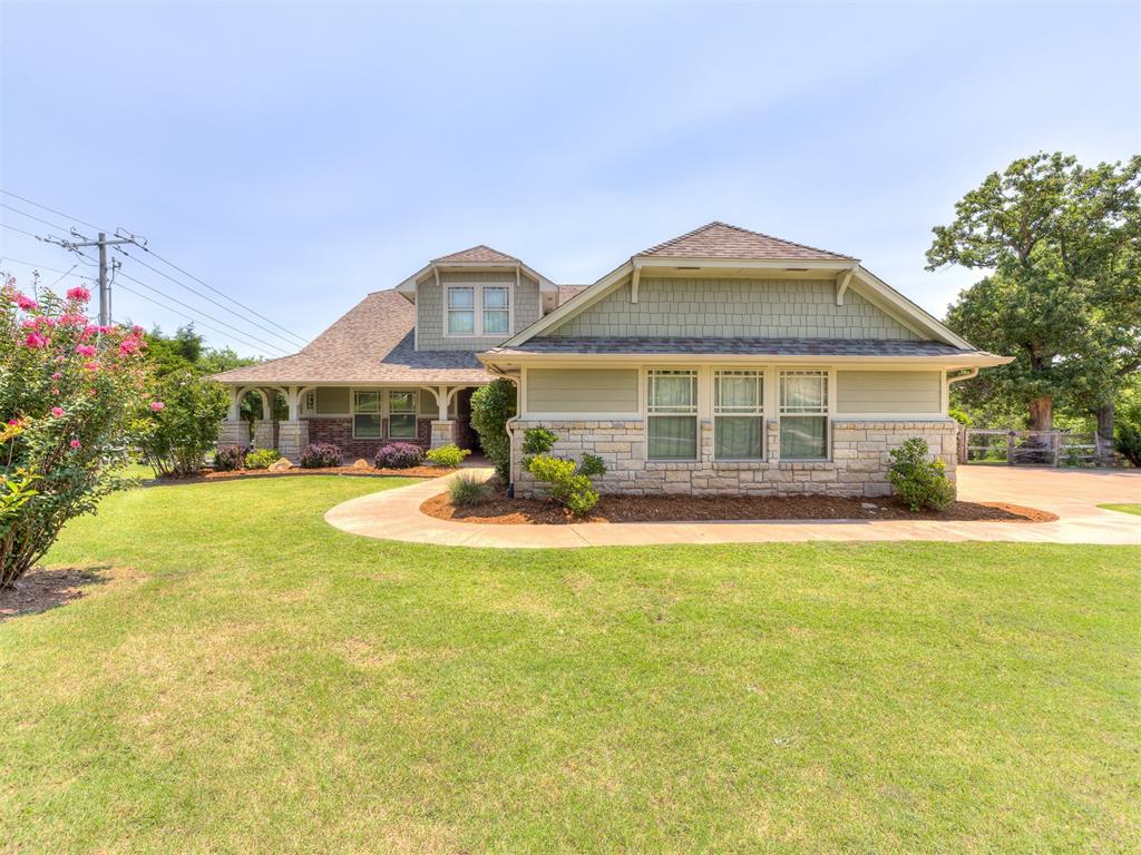 Nestled on a generous parcel of just over an acre in NE Edmond, this property offers the serene ambiance of country living with easy access to I-35. It places residents in the heart of convenience, close to schools, healthcare facilities, shopping centers, and entertainment venues. The essence of this home is captured in its expansive open spaces, designed for effortless living and distinguished by superior craftsmanship at every turn. The culinary dream kitchen is equipped with ample storage and countertop space, dual ovens, a gas stove, two islands, a deep stainless-steel farmhouse sink, and a walk-in pantry. Adjacent to the kitchen, a stunning study presents a versatile space, perfect as a playroom or TV lounge, complemented by a full bathroom. A cathedral ceiling adorned with wooden beams and a striking floor-to-ceiling stone fireplace accentuates the main living area. The owner’s suite is a sanctuary of comfort, featuring a large walk-in closet and a spacious bathroom that offers a variety of customization options, including laundry connections. It also provides private access to an expansive covered deck. An oversized three-car garage boasts an automated lift for attic access (and easy seasonal storage) and an epoxy-coated floor. The community enhances this idyllic setting with two ponds and ample greenbelt areas, ensuring a picturesque and tranquil living experience.