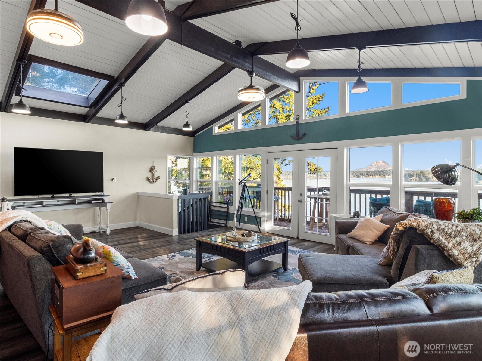 Back on market with new recent updates! Private waterfront living is waiting for you: Discover PNW Paradise in one of the most beautiful Islands in the Puget Sound. At the South edge of Harstine Island, this hidden gem has panoramic views of the Inlet & Mount Rainier. Sail by boat or drive out to this perfect escape from city life with room for entertaining & parties: sprawling decks, open floorplan, lots of parking & a buoy. Lovingly updated, this home has spacious kitchen & dining room with vaulted ceilings & a cozy woodstove, 2 bedrooms, 2 bathrooms, +downstairs Rec room/bonus room (could function as a 3rd bedroom) & utility room with 1/2 bath. Huge 2-bay garage shop (high ceiling), horseshoe pit & over $100k in recent landscaping gives a magical park-like feel! Walk the quality built staircase down to 73' of shoreline w/ tideland rights for oysters, clams & fishing! Community pool & water included in HOA fees. Don't miss this one!