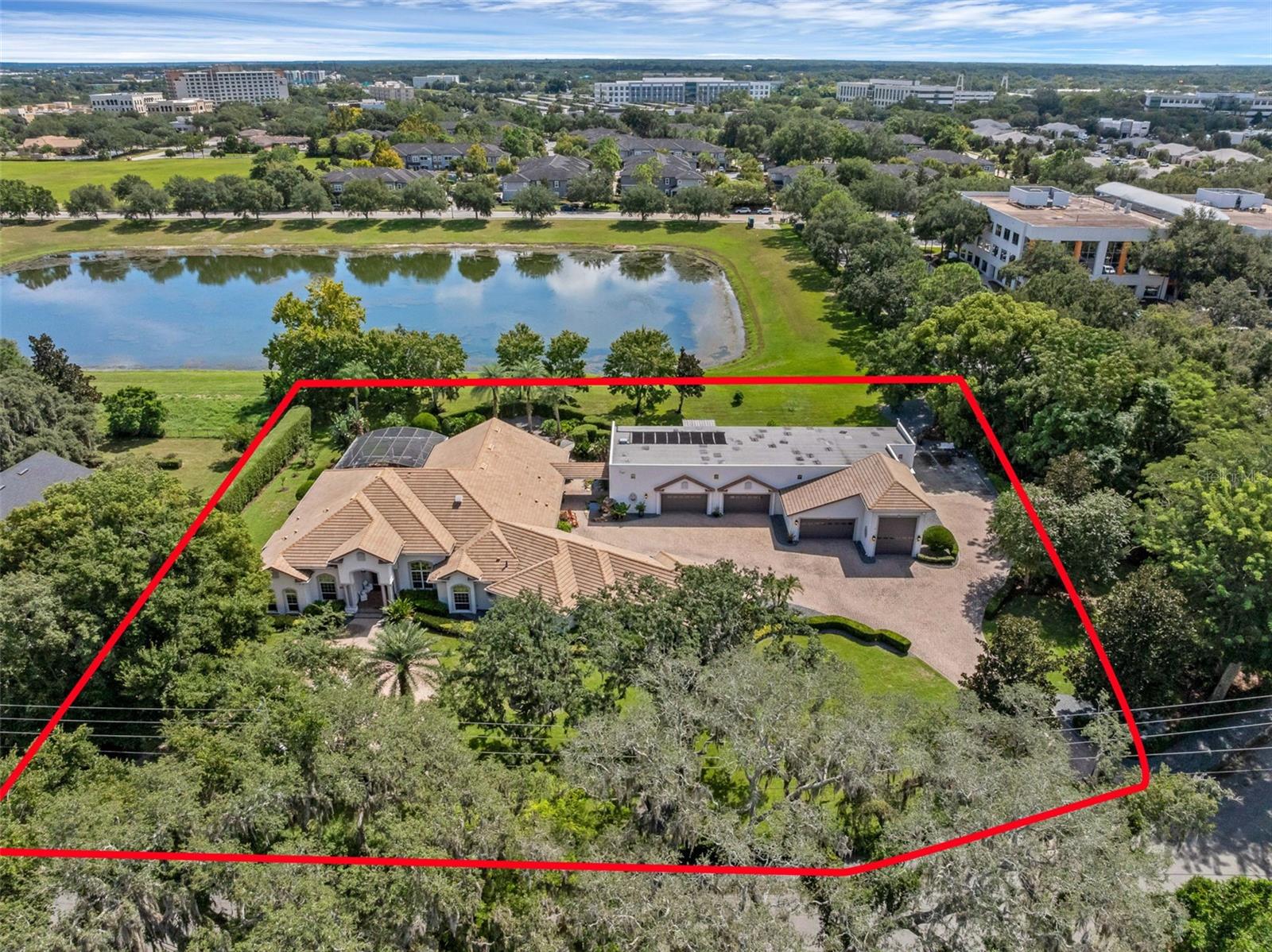 Live the Heathrow Lifestyle—Without the HOA!

Welcome to one of the most extraordinary custom-built estate homes in the heart of the Lake Mary/Heathrow area. This rare opportunity offers the prestige of Heathrow living without the fees, tucked away in a private, park-like setting just steps from International Parkway and Colonial Town Park.

Boasting an impressive 12,842 total square feet, this estate is designed for those who demand space, privacy, and unforgettable features. The main home spans 4,361 square feet with 4 bedrooms, 3.5 bathrooms, and a 5-car garage, offering an elegant and functional layout for everyday living. In addition, the detached building encompasses 8,481 square feet, complete with a full bath, multiple half baths, a 6-car garage, and 2 RV garages—making it a dream for car collectors and recreation enthusiasts alike.

Luxury details abound, including a natural gas-powered backup generator and a 2019 Signature Kitchen remodel by Lake Mary’s own Signature Kitchen, blending style and function at the heart of the home.

Car collectors and recreation enthusiasts will fall in love with the “Garage Mahal,” providing the ultimate showcase and storage space for all your toys. The lushly landscaped grounds set the stage for resort-style living. A tropical oasis awaits in the backyard, where a rock waterfall pool and expansive lanai create the perfect retreat. Entertain year-round in style with a full-size Thermador outdoor kitchen, built for hosting family and friends.

Inside, luxury continues with a state-of-the-art private home theater, valued at $400,000, that rivals and outperforms commercial cinemas. Whether it’s movie night, game day, or family gatherings, this one-of-a-kind feature takes entertainment to the next level.

With its unmatched size, design, and amenities, this “Home Extraordinaire” is truly one of the most unique estates available on the market today. Don’t miss your chance to own a property that blends lifestyle, location, and luxury in one remarkable package.