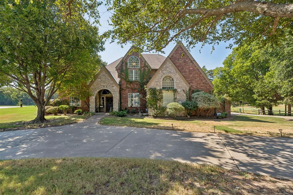 Exceptional Space, Beautiful Views, and 2 Acres in the Heart of Norman. Set on a picturesque 2-acre lot at the end of a quiet cul-de-sac, 1400 Pebble Beach Dr offers a rare combination of expansive grounds, golf course and pond views, established trees, and generous living space—all within the city. The University of Oklahoma is approximately 8 minutes away, with convenient access to I-35 in approximately 8–12 minutes.Inside, the spacious layout features 4 bedrooms, a dedicated study, 4 full bathrooms, two living areas, and two dining areas, providing an abundance of room throughout. Beautiful large windows in every room bring in natural light and showcase the surrounding trees and golf course setting. Rich mahogany woodwork adds warmth and character, while a striking double staircase creates an impressive focal point as you enter the home.The oversized kitchen offers tons of cabinetry and generous workspace, along with new countertops, a new kitchen sink, and new tile extending into the family room. The dedicated study is especially inviting with wood-paneled walls and a built-in bookcase. Throughout the home, thoughtful updates include new toilets, bathroom sinks, a new primary bath tub, and a new downstairs shower.Extensive improvements provide both style and peace of mind, including two new HVAC systems, a new water heater, new septic panel, reverse osmosis system, and a new roof installed September 2026.The outdoor setting is equally impressive. Established trees surround the property, while the spacious grounds capture beautiful golf course and pond views. Recent exterior improvements include wrought iron and split-rail fencing, a back porch pergola, a flagstone patio, and additional concrete along the side driveway by the garage.1400 Pebble Beach Dr offers a distinctive Norman property with space, character, and a setting that is difficult to replicate.