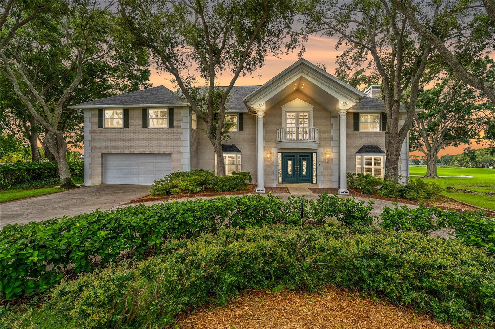 Step into timeless elegance in this stunning Colonial-style estate home located in the heart of Feather Sound ~ one of Clearwater’s most sought-after golf course communities. With 4 bedrooms, 3 full bathrooms and over 4,800 square feet of beautifully designed living space, this impressive home is perfectly positioned on the prestigious Feather Sound Country Club Golf Course. Enjoy panoramic views from nearly every angle, with the backyard overlooking the 17th hole and 18th tee box, while the front of the home gazes across the 2nd and 11th holes. From sunrise to sunset, the scenery is nothing short of spectacular.

As you arrive, you’re greeted by a circular driveway and a grand entrance that sets the tone. Step inside the marble-floored foyer and be immediately impressed by the sweeping oak staircase and luxurious details that carry throughout the home ~ fluted molding, wood-burning fireplaces with fossil stone accents, plantation shutters and a built-in surround sound system. Everything has been thoughtfully designed and meticulously maintained, including a brand new roof (2025), a new water heater (2024), and three zoned A/C units (2024, 2018, 2018).

The heart of the home is the beautifully appointed kitchen featuring granite countertops, a spacious island, white cabinetry with pull-out drawers, new KitchenAid appliances, a wine fridge and a breakfast nook with French doors that open out to your private lanai and pool area. Whether you’re hosting a holiday dinner or a casual pool day, the layout offers flexibility with a large family room, formal dining room and formal living space ~ perfect for entertaining!

The expansive primary suite feels like its own private retreat. Enjoy a luxurious walk-in closet with a custom storage system, a cozy fireplace, a built-in coffee bar with refrigerator and microwave, and a spa-like bathroom featuring a walk-in shower, soaking tub and dual sink vanity. You’ll also have direct access to the second-floor balcony to enjoy peaceful mornings or unwind in the evening.

Out back, relax in your own slice of paradise ~ complete with a screened-in 20,000-gallon pool and covered patio area overlooking the gorgeous golf course views! And with one of the highest elevations in Feather Sound, you’ll have added peace of mind.

Feather Sound offers a private club experience without HOA fees or deed restrictions. Optional memberships are available for golf, tennis and the clubhouse. Located just minutes from beaches, downtown St. Pete, Tampa, Safety Harbor and two international airports ~ this home is the perfect blend of luxury, comfort and location.
