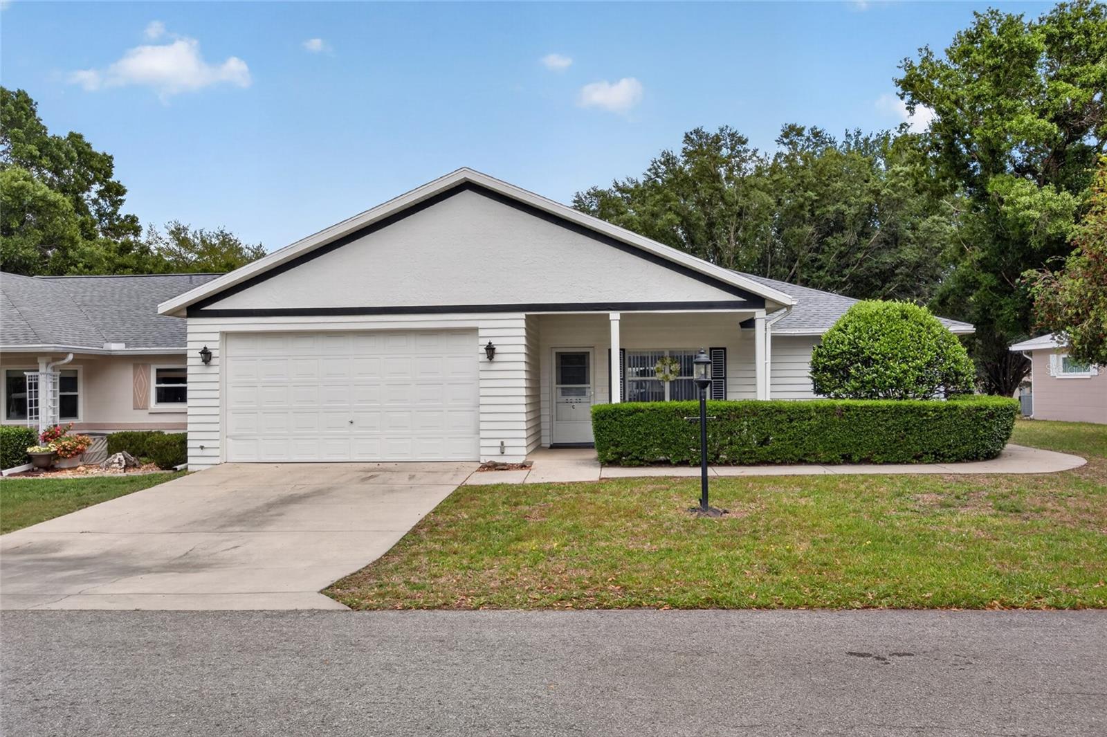 CDD PAID OFF!  1.5 car garage. Move-in ready Bostonian model villa in Crescent Ridge neighborhood of On Top of the World has 2-bedrooms, 2-bath and has 1,982 sq. ft. under AC. New roof Feb. 2026. New 4-ton A/C installed May 2025. Beautifully maintained and updated home with an oversized 1.5 car garage provides ample room for storage, a golf cart, and workspace needs. A standout feature is the extra-large enclosed sunroom which creates an expansive family room. Large kitchen with island and pantry, plenty of storage and food prep space. 3 living areas plus a dining room for ample living space. Primary bedroom has French doors, large walk-in closet and an ensuite updated bathroom. The large secondary bedroom with lots of natural light can accommodate a king size bed. 2 solar tubes in the family room for natural light and ceramic tile and luxury vinyl plank flooring throughout. The open floor plan home welcomes you with a covered front porch with plenty of room for chairs to enjoy the mature trees and shade. The updated bathrooms add a modern touch, while the real wood cabinetry brings warmth and timeless quality to the kitchen and bathrooms. Designed for easy, low-maintenance living, this villa allows you to spend less time on upkeep and more time enjoying the many amenities and active lifestyle the community provides. Perfect for those seeking a blend of comfort, convenience, in a community with over 175 clubs, a Billiards room, State-of-the-art fitness center, Aquatic center, Tennis center with lighted tennis courts with 10-ply plexi-cushion surface, Group fitness classes. Indoor heated pool with lap swimming, and water aerobics with retractable roof, Large outdoor heated walking pool with spa, Bocce ball courts, R/C flying field, drone course & race car track, community gardens, golf, dance plus many more amenities. Conveniently located for easy access to grocery stores, restaurants, entertainment, hospitals and healthcare facilities.