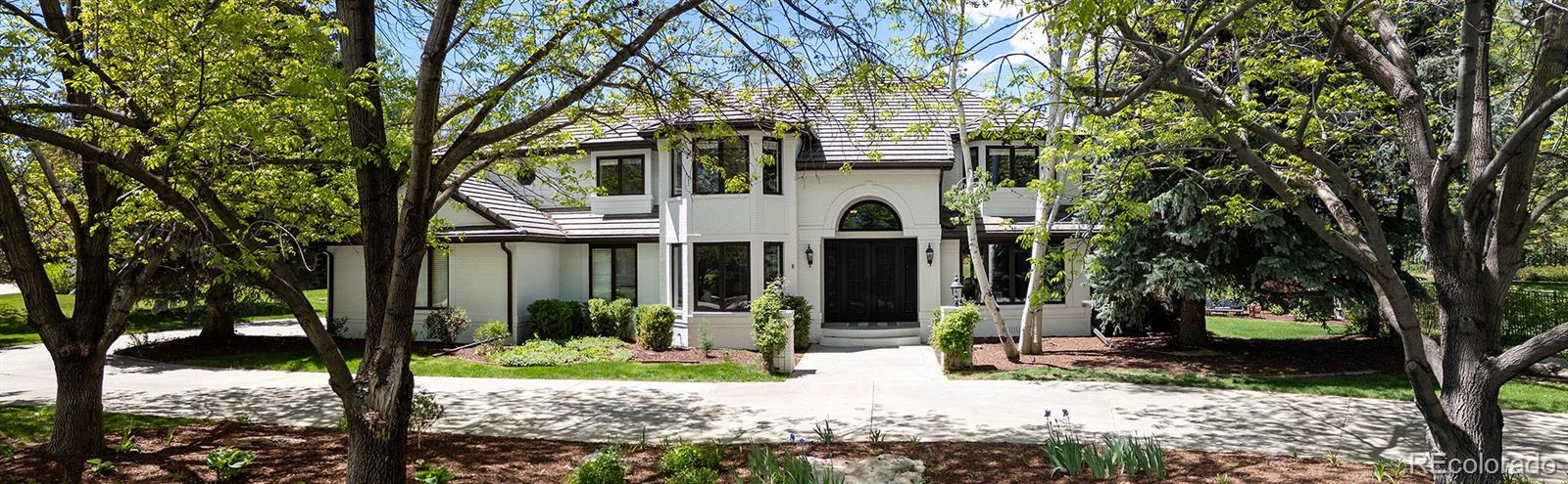 Welcome to the luxury oasis at 5345 S Race Ct—an exquisite and fully updated 4-bedroom, 5-bathroom estate nestled at the end of a peaceful cul-de-sac in the heart of Greenwood Village. This 6,627 sq ft residence sits on a lush, park-like 1-acre lot and has been thoughtfully renovated to elevate both style & function. Refined finishes, soaring ceilings, & picturesque views of the beautifully landscaped grounds are focal points of this beautiful home. A stunning remodel centered around a fully reimagined kitchen, creates a seamless flow anchored by custom high-end cabinetry, premium quartz countertops, and top-of-the-line gourmet Miele appliances including; dual microwave/steam/convection ovens & induction cooking range. Natural light floods the open-concept living area, w/ a gas starter wood burning stone fireplace, custom screen, and Samsung Frame TV. The main floor has a separate great room & living room, an office (or extra bedroom) w/ private access to a 3/4 bathroom. Upstairs you are greeted w/ new carpet in all 4 Bedrooms, updated bathrooms w/ new vanities, fixtures & flooring. The oversized basement is complete w/ full bathroom, new carpet and paint. This spacious area features a pool table and plenty of space for entraining and watching Colorado's favorite sports teams. Step outside into the backyard paradise featuring a heated pool with retractable safety cover, 8 person Caldera Hot tub, a covered outdoor sitting area w/ stone fireplace, and a gourmet outdoor kitchen complete with built-in Memphis pellet smoker/grill. The new wraparound deck effortlessly connects the indoor and outdoor spaces, making this home ideal for hosting and enjoying the outdoor Colorado lifestyle. Located just steps from the High Line Canal Trail and only minutes from Cherry Creek, DTC, & downtown Denver. This exceptional home offers privacy, convenience, and resort-style amenities in one of Greenwood Village’s most desirable neighborhoods. https://www.youtube.com/shorts/bd9HNqv98ps