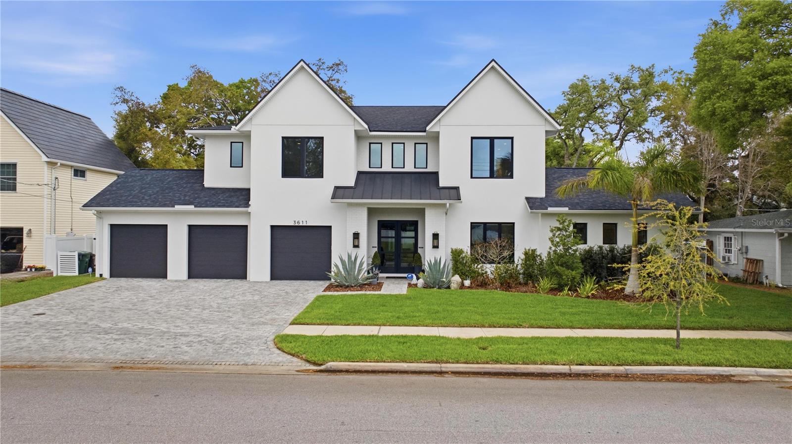 Under contract-accepting backup offers. Welcome to 3611 W Barcelona St, a breathtaking South Tampa pool home offering over 5,000 square feet of refined living with 5 bedrooms, 7.5 bathrooms, and a 3-car garage. This showstopper is move in ready and thoughtfully designed, this home blends modern elegance with everyday functionality. Inside, hardwood and tile floors flow throughout a bright, open layout. The chef’s kitchen serves as the centerpiece, featuring a 10’ waterfall-edge island, apron sink, Thermador appliances, custom cabinetry, walk-in pantry, double dishwashers, ice maker, oversized wine refrigerator, and a beverage refrigerator. The first floor includes a luxurious primary suite with a spa-like bath and custom walk-in closet with its own private laundry station, along with a grand room opening to an oversized covered lanai, formal dining room, and study. Upstairs offers a second primary suite, three additional en-suite bedrooms with walk-in closets, a spacious media/recreation room with a private bathroom, and an additional oversized laundry room. Custom built-ins throughout the home include a mudroom, dining room beverage bar with Sub-Zero refrigerator and U-Line ice maker, and additional cabinetry that enhances both style and storage. High-end features include a whole-house generator, Control4 automation, whole-home WiFi, security system, in-ceiling speakers, smart blinds, designer lighting, impact windows, and multi-zone HVAC. Step outside to your private oasis with a pool, outdoor kitchen, automated lanai screens, and beautifully upgraded landscaping complete with palm trees, uplighting, artificial turf, putting green, and golf hitting pad. Not to mention an exclusive full bathroom on the lanai to function beautifully for pool guests. An eco-friendly mosquito system ensures year-round comfort. Located on a 100 x 100 lot in the highly desirable Roosevelt, Coleman, and Plant school district, and just minutes from Bayshore Blvd., Downtown Tampa, Tampa International Airport, and top dining and shopping. A big bonus is that this home is not in a flood zone to save you on insurance and peace of mind. With exceptional upgrades, thoughtful design, and luxurious finishes throughout, this home offers the perfect balance of comfort, style, and functionality. Schedule your private showing today.