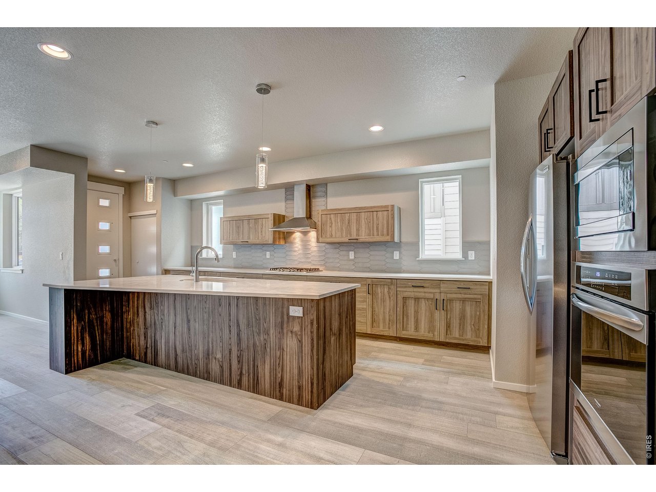 Beautifully designed 3-bedroom, 3-bath home in the desirable River Modern community with direct access to Spring Creek Trail and across from Indian Hills Park. The open-concept floor plan features a modern kitchen with European-style cabinetry, quartz countertops, and stainless steel appliances. Upstairs, the spacious primary suite offers a walk-in closet and spa-inspired shower, while the secondary bedrooms share a Jack-and-Jill bath. Oversized 2-car garage. Schedule your showing today!