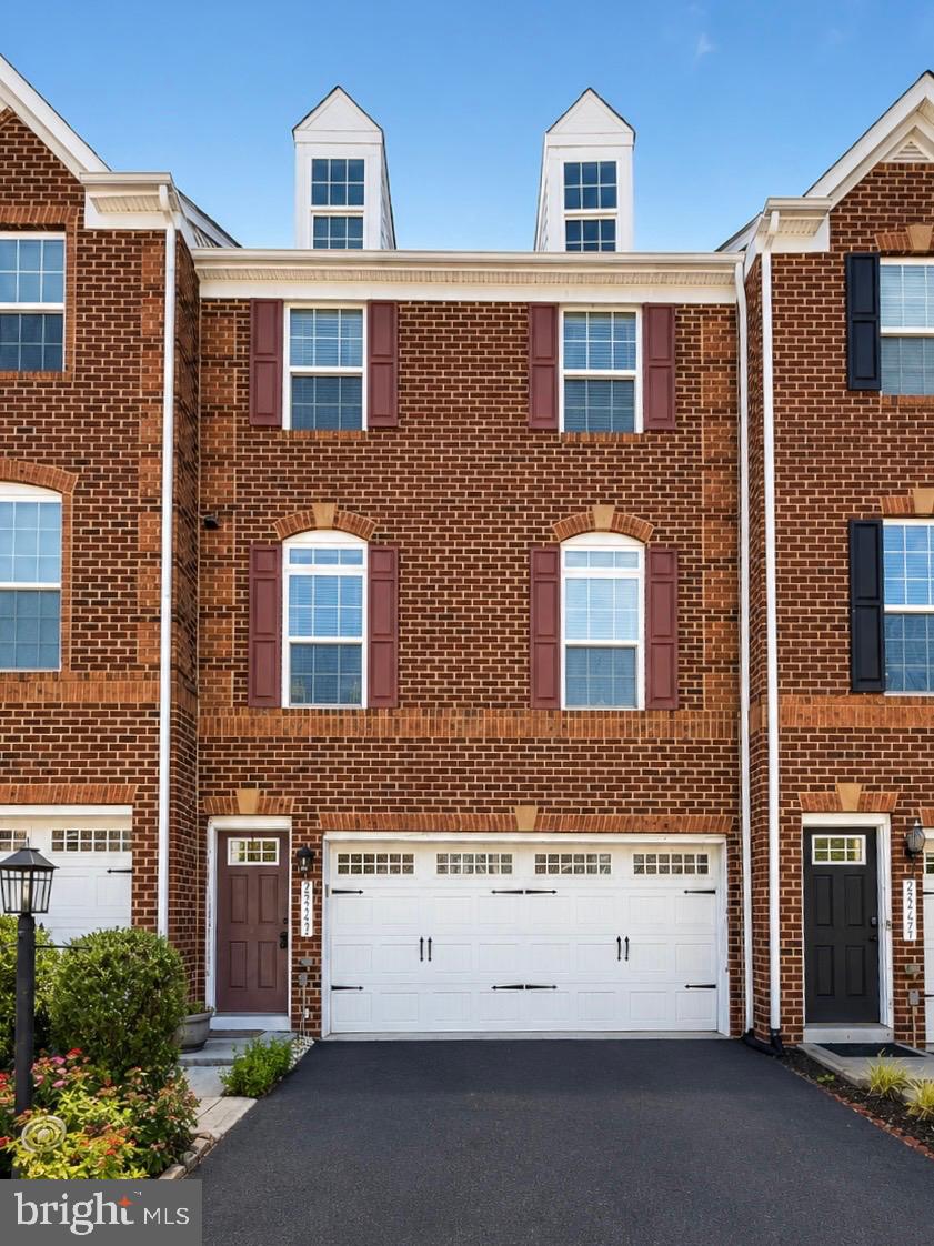 Welcome to this beautifully well-maintained east-facing townhome in the sought-after Virginia Manor community, offering 3 spacious bedrooms and 3.5 bathrooms.The sun-filled main level features a bright and inviting living room that flows seamlessly into the kitchen and dining area. Just off the kitchen, step onto the large composite (Trex) deck overlooking a beautifully stamped concrete patio. The backyard and deck offers the perfect setting to entertain, relax, or enjoy breathtaking sunset views and vibrant pink evening skies, while also providing plenty of space for home gardening with room to grow your favorite flowers, herbs, or vegetables.Upstairs, you'll find generously sized bedrooms along with the convenience of an upstairs laundry room.The finished lower level features a spacious recreation room and a full bathroom, providing the ideal space for guests, a home office, a home gym, or additional living and entertainment space.Additional highlights include newly installed exterior lighting at both the front and rear of the home, enhancing both curb appeal and security. The spacious garage features a recently epoxied floor, offering a clean, polished look and easy maintenance. Ample visitor parking is conveniently located nearby.Priced below appraised value and exceptionally well maintained over the years, this home presents an outstanding opportunity to own in one of the area's most desirable neighborhoods. Enjoy the amenities, convenience, and sense of community that Virginia Manor has to offer. Schedule your private tour today!