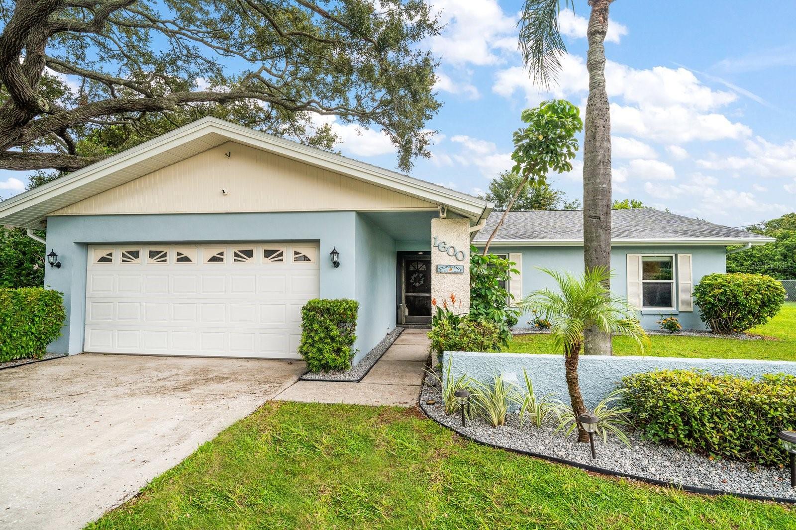 Dunedin Pool Home situated on .25 acre lot in a Non-Flood Zone. This move-in ready home checks all the boxes with major updates already completed: Brand New Roof, Brand New Electrical Panel, Brand New Screen Enclosure over the pool and newer windows for peace of mind. Inside, the home has been freshly painted and features a spacious open floor plan with wide plank laminate flooring in most areas, faux wood blinds, recessed lighting and a large eat-in kitchen. The primary bedroom offers a walk-in closet, en suite bathroom and private access to the outdoor pool area. Perfect for entertaining, sliders open to an oversized screened pool area designed for year-round enjoyment. Additional highlights include a Low HOA at just $20/year. Located in a Golf Cart Zone for easy access around town with only 2 miles to vibrant Downtown Dunedin with boutique shops and restaurants and minutes to the Pinellas Trail and Dunedin Causeway.  As a bonus, a 2022 Icon I40 Golf Cart is available with an acceptable offer.