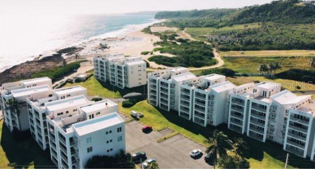 Your oceanfront home in Isabela awaits! Enjoy spectacular coastal views from this beautiful 1,500-square-foot apartment, fully furnished and equipped, offering spacious interiors in a prime location.Featuring 3 bedrooms, 2.5 remodeled bathrooms, and 2 assigned parking spaces, this apartment boasts an open-concept layout that seamlessly connects the living room, dining area, and kitchen, creating a comfortable and inviting atmosphere. The kitchen includes modern appliances and granite countertops.Your private ocean-view balcony is the perfect spot to enjoy the sea breeze and unwind to the soothing sound of the waves.Community amenities include:Security guard and elevators.Swimming pools with a jacuzzi.Clubhouse and recreational areas.Fitness center.Basketball and tennis courts.Just steps from some of Isabela’s most beautiful beaches and minutes from restaurants, shops, and local attractions.Make your dream of oceanfront living a reality. Call today for more information or to schedule a showing!