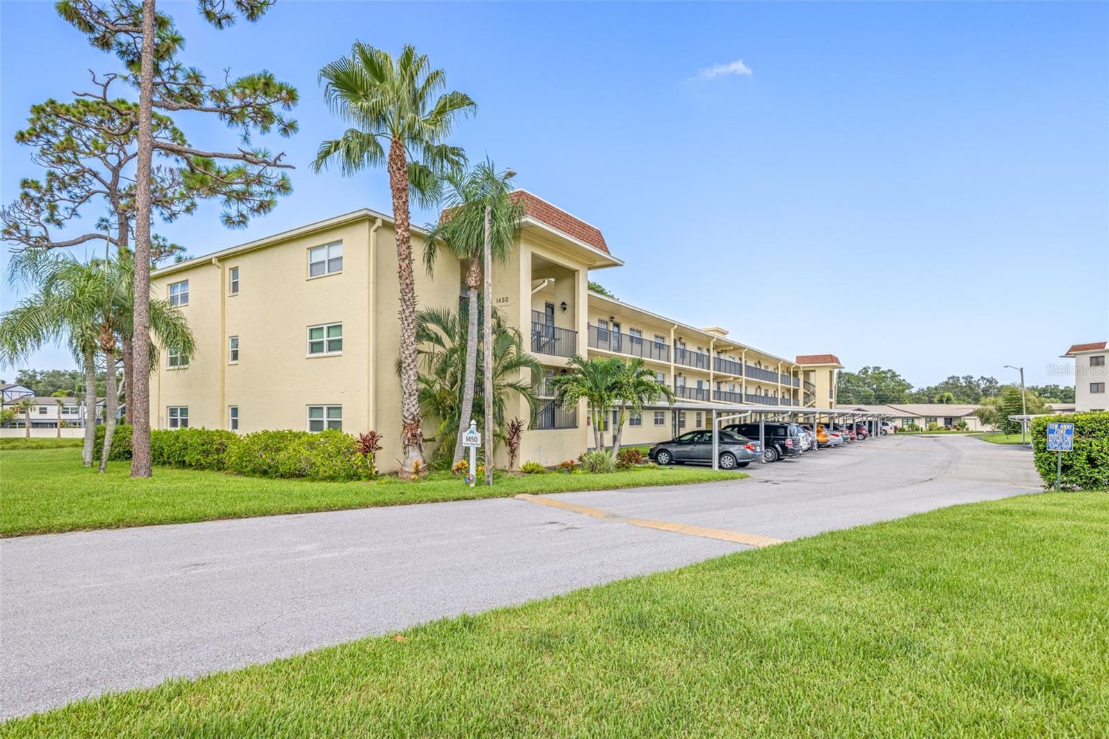 Discover Heather Ridge A Vibrant 55+ Community in Coastal Dunedin! Welcome to this charming condo in Heather Ridge, a sought-after 55+ community in beautiful Dunedin. Ideally located on the third floor next to the elevator, this unit offers convenience at its best, with assigned parking directly in front of the elevator for easy access. Plus, this no-flood-zone community provides peace of mind while being just 10 minutes from downtown Dunedin and close to world-class beaches, including Honeymoon Island, Caladesi Island, and Clearwater Beach. Enjoy shopping at Countryside Mall and a variety of dining destinations, all just minutes away! Step inside to an open floor plan filled with natural light, leading to a private balcony with tranquil pond views the perfect spot for morning coffee or evening relaxation. New appliances- refrigerator & electric range stove. Building 1450: Upgraded for Long-Term Value & Comfort This well-maintained building has undergone extensive improvements, including: -New balconies and patios (2022) -Fully redone elevated walkways (2018) -Modern night elevator (2023) -Updated laundry equipment (2021) -New roof (2015) -Clean milestone report attached With over $1 million invested in maintenance and beautification, residents enjoy updated amenities, including a heated community pool, on-site laundry facilities, and a secure, well-maintained environment. Don’t miss this rare opportunity to own a piece of paradise.