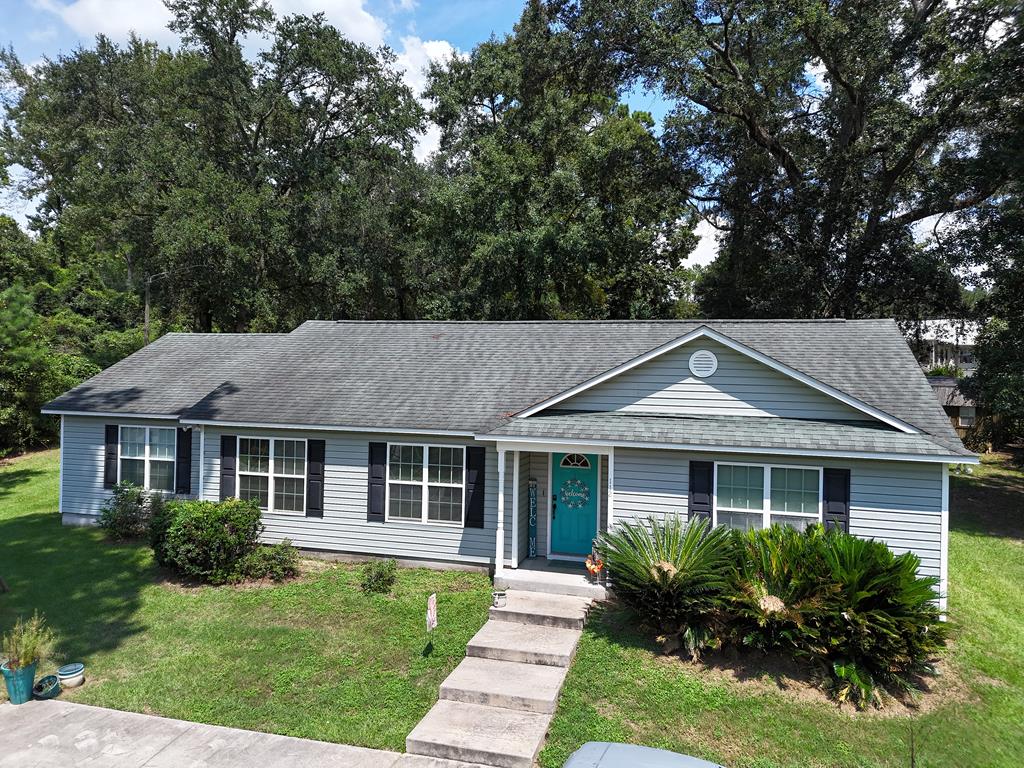Welcome to 112 Henry's Rd in Thomasville, GA! This 4-bedroom, 2-bathroom home blends contemporary design with the tranquility of country living. Spanning 2,017 sq ft, per the seller, the interior boasts stylish finishes and a modern layout that offers comfort and functionality. Step outside to enjoy a spacious half-acre yard, perfect for gardening, play, or simply unwinding. The back patio and deck make it easy to entertain or relax in the peaceful surroundings. If you're looking for a home that combines space, style, and a serene setting, this is it!