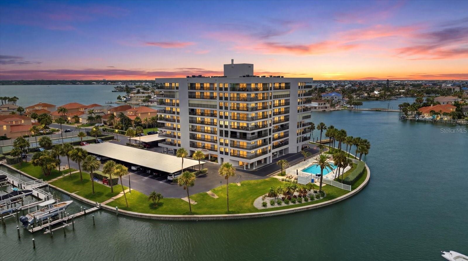 This well maintained condo has exceptional views of the Gulf, Sand Key Beach and the Intracoastal!  It is perfectly positioned for just a short walk to the sugar sand beaches where you can enjoy year-round sunsets over the water.  Then it's on to the Shoppes of Sand Key with restaurants and boutique shopping.  This is also a true Boaters Paradise with boat slips frequently available to rent or purchase.  Clearwater Pass is extremely close, making the Gulf quickly accessible.  A building restoration followed a 2025 Milestone Inspection, creating long-term value and confidence in future ownership.  The building and landscaping underwent extensive renovation that same year.Don't miss out on this rare opportunity to own a "Piece of Paradise" on well known Sand Key!