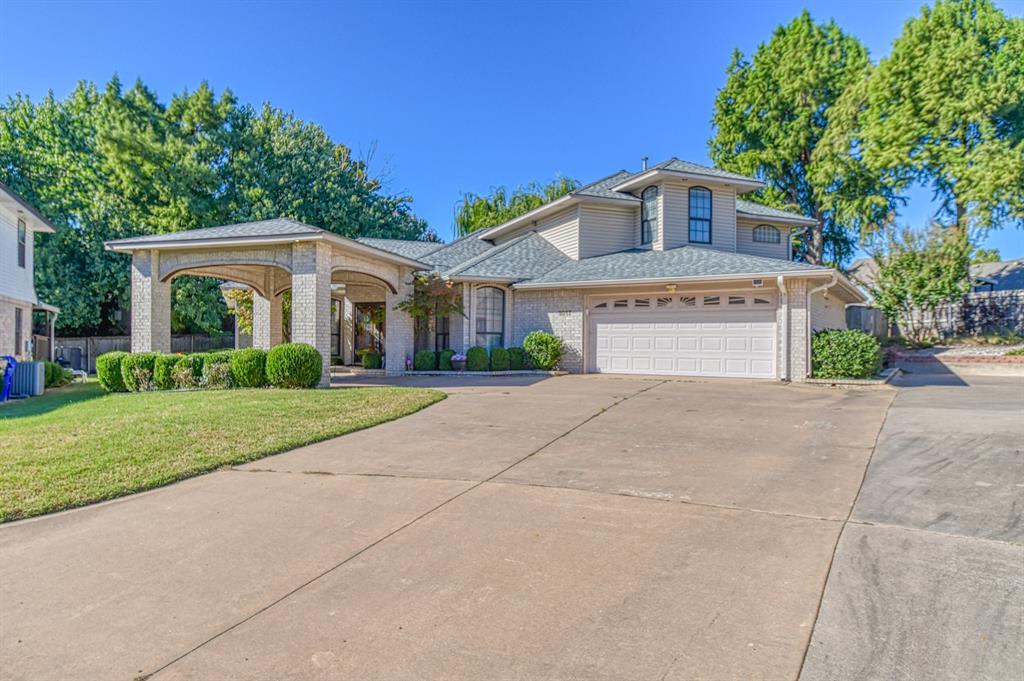 Welcome to 3617 Hampton Court  nestled in a quiet Cul-de-sac close to all your favorite shops and restaurants. This spacious home features 3,505 of living space with 3 living areas, study, 4 bedrooms and 2 and a half bathrooms. Step inside to the first living area with a gas fireplace that is shared and separates the second living area. Off the first living area is the formal dining room and the study. Step into the second living area and enjoy that same fireplace with bookshelves on each side. The spacious kitchen is open to this second living area with lots of room to cook and plenty of cabinets for storage. The island serves as work space or seating for meals.  The Florida room is also off the second living area and this room would be great for so many things with its  vaulted ceilings and 3 sliding doors with so much sunlight coming through. The primary suite which is located downstairs is a true sanctuary, offering a luxurious en-suite bathroom with double vanities and generous closet space with laundry room inside the closet. The Additional bedrooms which are located upstairs are spacious with walk in closets. The bathroom upstairs is truly amazing with double vanities including a sitting area to get ready. The tub is a large soaking with shower. You will also find a second laundry room upstairs so no hauling laundry downstairs.  The front of the home has a covered parking area or use it for a large covered patio. Out back you will find a deck the whole length of the back of the home.  This home is in impeccable condition, showcasing an abundance of natural light through numerous windows. Recent updates include a roof that is two years old, two separate HVAC systems that were installed in 2024.