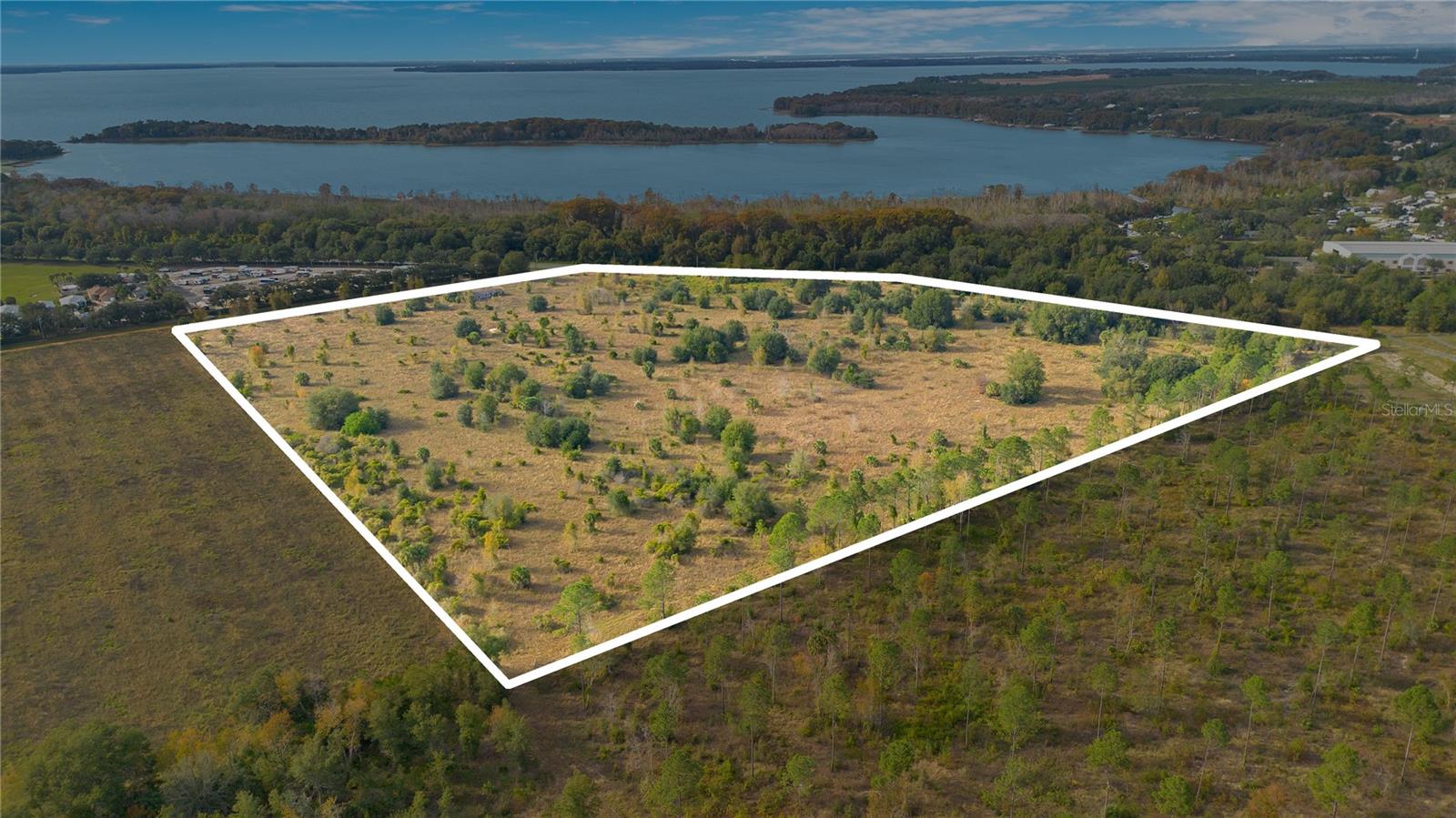 RARE opportunity to own just over 35 acres (HIGH and DRY) right on SR 19!! There are 4 contiguous parcels totaling 35.07 acres. With NO HOA, the possibilities for what this land can be used for are ENDLESS! -- Residential Development, Commercial Development (with a zoning change application), or a Massive Family Compound!! This property is right off the Harris Chain of Lakes (Bass Fisher's Dream). There are several new housing developments in the area, a Publix just over a mile away at the Tavares Crossroads, The Mike Stone Soccer Complex that spans over 13 acres with 6 beautiful soccer fields and LOTS of growth and commercial development happening in the area. Located less than an hour away from Downtown Orlando, this area is growing fast so now is the time to get in while you can! Call today for more information!