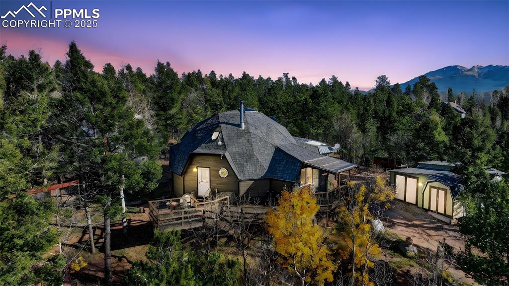 Unique Geodesic Dome Cabin with Stunning Pikes Peak Views!

Discover this beautifully upgraded geodesic dome cabin on two lots, offering breathtaking views of Pikes Peak and the surrounding forest. Perfectly tucked away in Teller County, this hidden gem borders Pike National Forest for added privacy and endless outdoor recreation.

Inside, you’ll love the newly remodeled kitchen featuring granite countertops, LED lighting, and a five-burner stove. Comfort meets efficiency with radiant in-floor heating, a reverse osmosis water filtration system, and a layout designed for everyday living or entertaining. A bonus area off the dining room offers a versatile extra space. The home offers two primary suites—one on each level—each with its own bath, multiple skylights ideal for stargazing in your own living room and you can enjoy watching wildlife from your front porch. 

Step outside to enjoy a brand-new deck (installed September 2025), a wrap-around porch, and a circular driveway with extra parking and RV space. The property also includes access to a whimsical earth ship sauna, the perfect retreat after a day of exploring.

This property blends organic modern design with Colorado mountain charm, combining cedar, log, and adobe construction. Whether you’re looking for a year-round residence, a vacation getaway, or a turnkey Airbnb/VRBO investment, this home delivers unmatched versatility—no HOA and no city short-term rental restrictions.

Just 10 minutes from Woodland Park, this rare find offers the ultimate Colorado lifestyle with hiking, biking, ATVing, and snowmobiling right from your doorstep.

Schedule your showing today and experience mountain living at its finest!