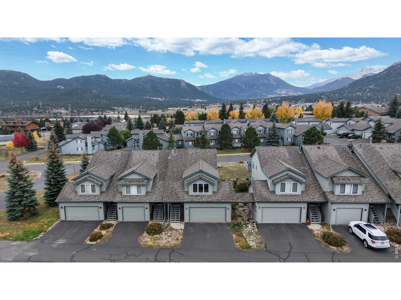 This condo is not on the highway and is move-in-ready. A comfortable and inviting condo with beautiful mountain views in the Ranch Meadows neighborhood of Estes Park. Convenient to downtown shopping, entertainment and eating. The kitchen opens to the living room, creating an easy flow for cooking, dining, and gathering around the gas fireplace on cool evenings. Updated appliances, clean finishes, and thoughtful touches throughout make this condo truly a move-in ready. Step outside onto your private deck and take in the views of Twin Sisters and the Continental Divide. Whether you are enjoying morning coffee, spotting wildlife, or watching a mountain sunset, the view never disappoints. With three bedrooms and two bathrooms, there is space for family, guests, or even a home office. Located just minutes from downtown Estes Park, this home offers quick access to local dining, shopping, Rocky Mountain National Park and the endless outdoor adventures that define life in the Rockies. Whether you make it your full-time residence or a peaceful mountain getaway, This condo offers a comfortable, easygoing lifestyle surrounded by some of Colorado's most inspiring scenery. Great permanent residence or a vacation getaway where you don't have to worry about maintenance. High speed internet available.
