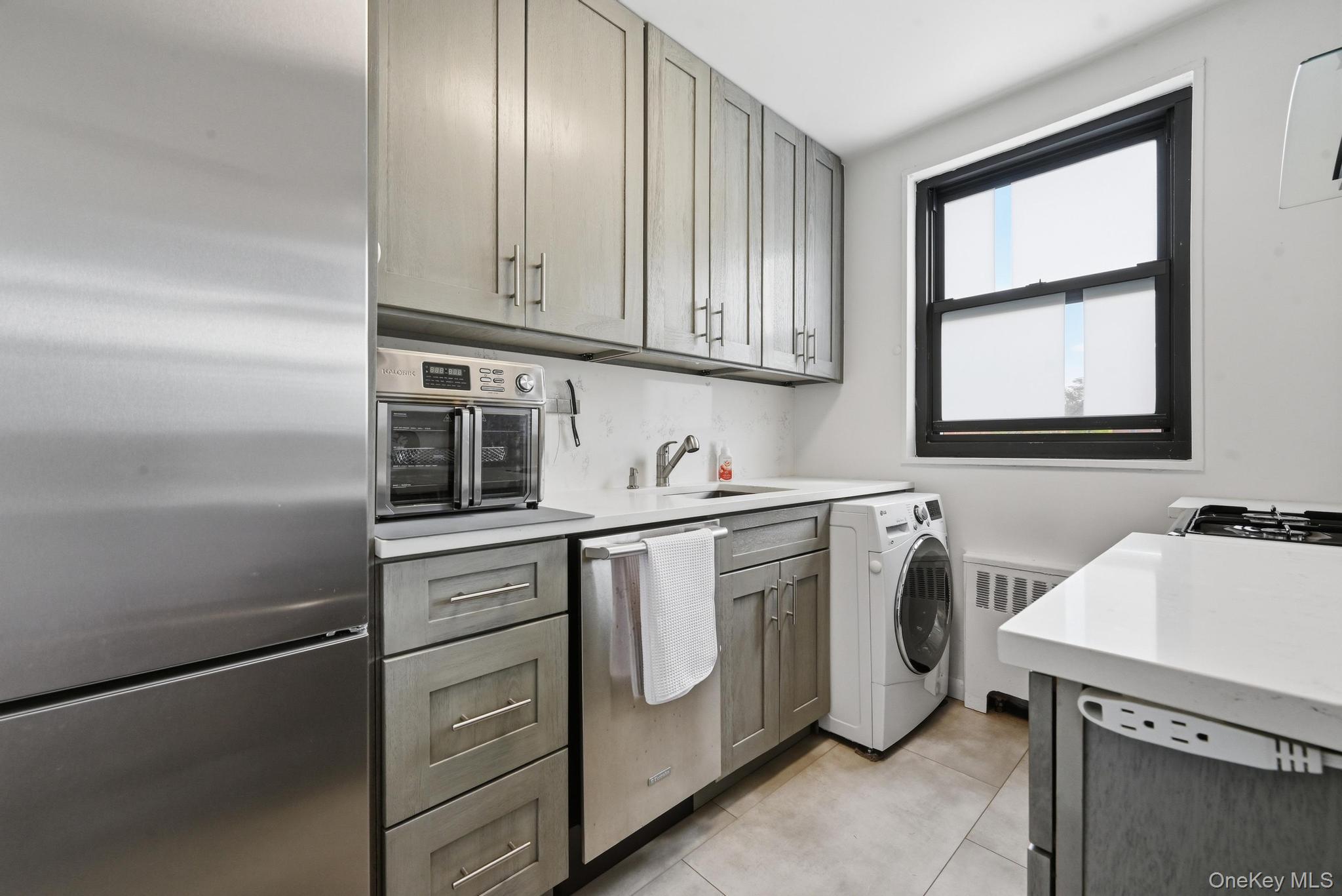 Sun-drenched, beautifully renovated, and move-in ready—this spacious 2-bedroom co-op is a true gem in Whitestone. Nestled in a serene setting surrounded by lush greenery, this home offers an abundance of natural light, modern finishes, and exceptional convenience.Step inside to a spacious open living area, perfect for relaxation and entertaining. The modern open kitchen features beautiful quartz countertops, stainless steel appliances, a large bar, ample cabinetry, a dedicated dining area, and the added convenience of an in-unit washer/dryer. The king-sized primary bedroom and queen-sized second bedroom provide generous space, while beautiful hardwood flooring, recessed lighting, and new windows enhance the home throughout. A full attic offers excellent additional storage.Monthly maintenance includes electricity, gas, heat, water, and real estate taxes, providing outstanding value. Additional storage and garage parking are available for rent.Ideally located just minutes from major highways, bridges, and public transportation, including local buses Q16 and Q76 to Flushing and express buses QM2, QM20, and QM32 to Midtown Manhattan. Close to PS 209, JHS 194, shopping, restaurants, Clearview Park Golf Course, Little Bay Park, and beach rights.A wonderful opportunity to own a modern, peaceful home in a prime Whitestone location!