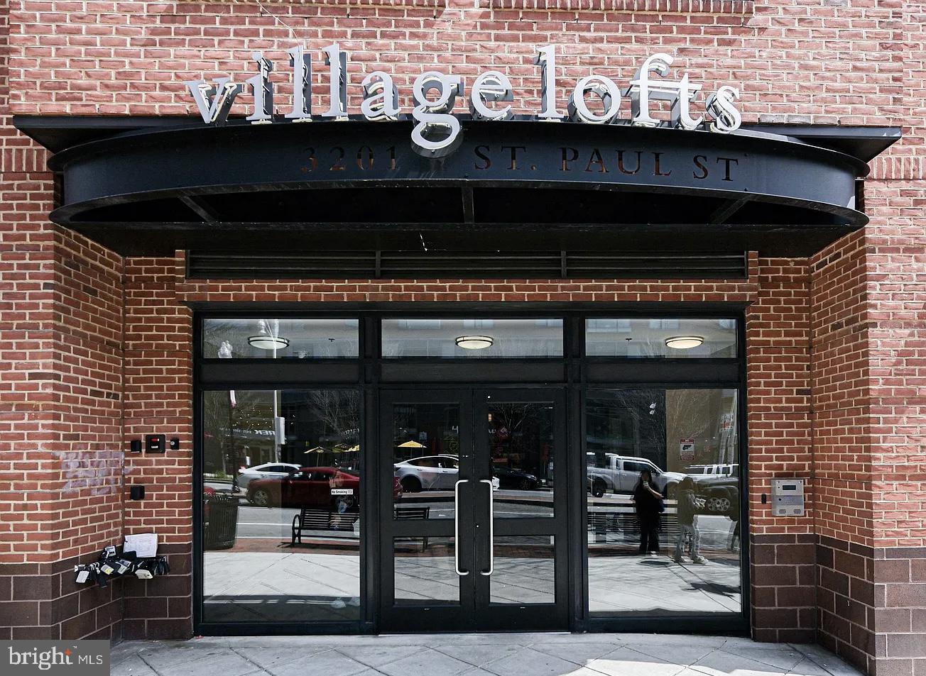 Wonderful and open oversized one bedroom corner unit in the Village Lofts! Tons of natural light from the many large windows.. Updated kitchen with stainless steel appliances and granite countertops. Convenient island kitchen with breakfast bar seating flows perfectly to the dining and living spaces. A large south facing outdoor patio is sure to be a favorite. New HVAC installed 2025.  Just freshly painted throughout entire unit. Super convenient access to all shops and restaurants that Charles Village has to offer as well as neighboring Johns Hopkins University's Homewood Campus. Private deeded garage parking space conveys with unit. An easy commute to Penn Station as well!