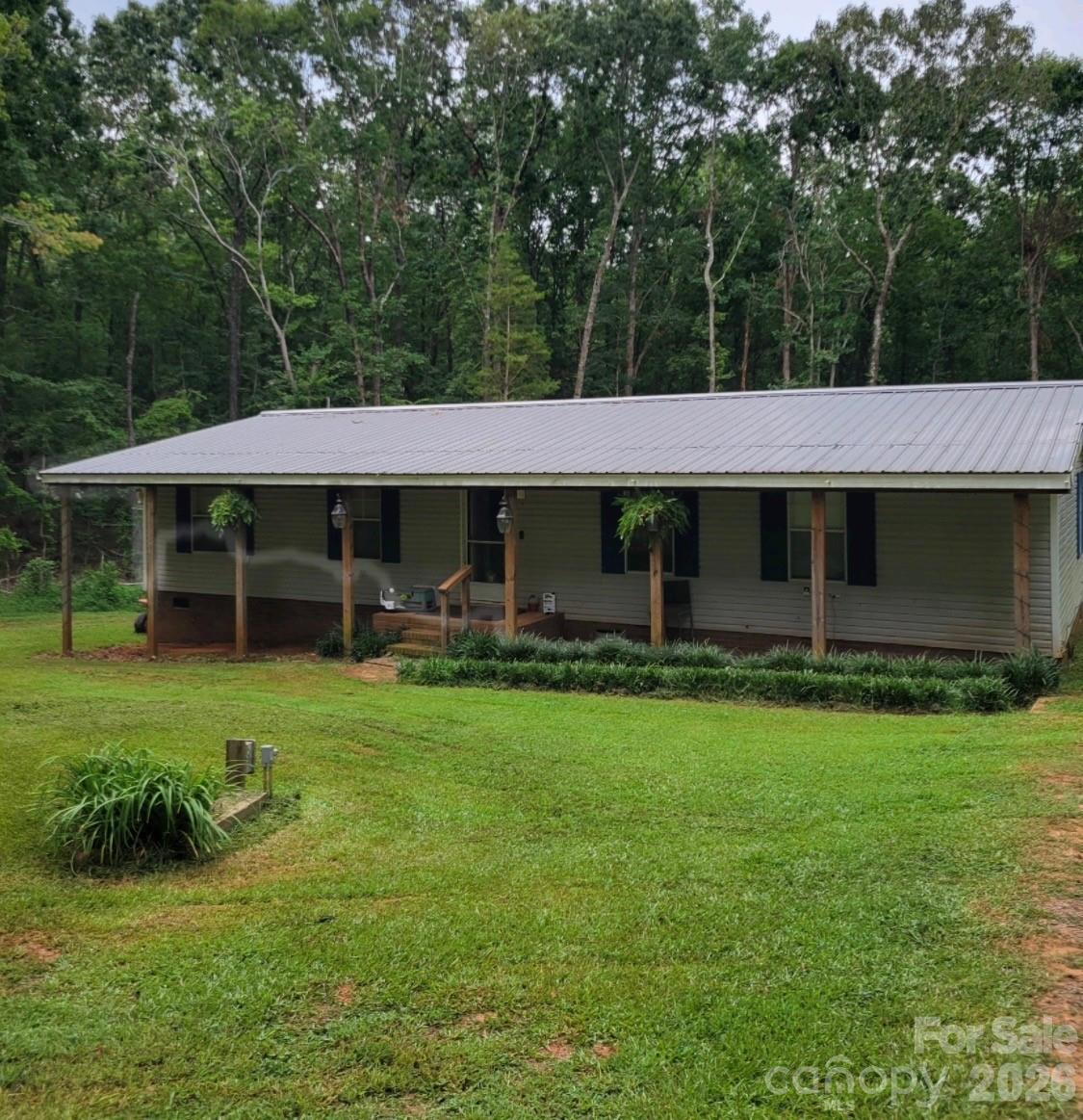 This is a great opportunity for someone looking for an estate style lot with room for horses or a small farm. Just over 4.2 acres of land in unincorporated Union County means no City Taxes. This property is being sold as-is. 3 bedroom, 2 bath manufactured home on the property. Conveniently located a short distance from Lancaster Highway.