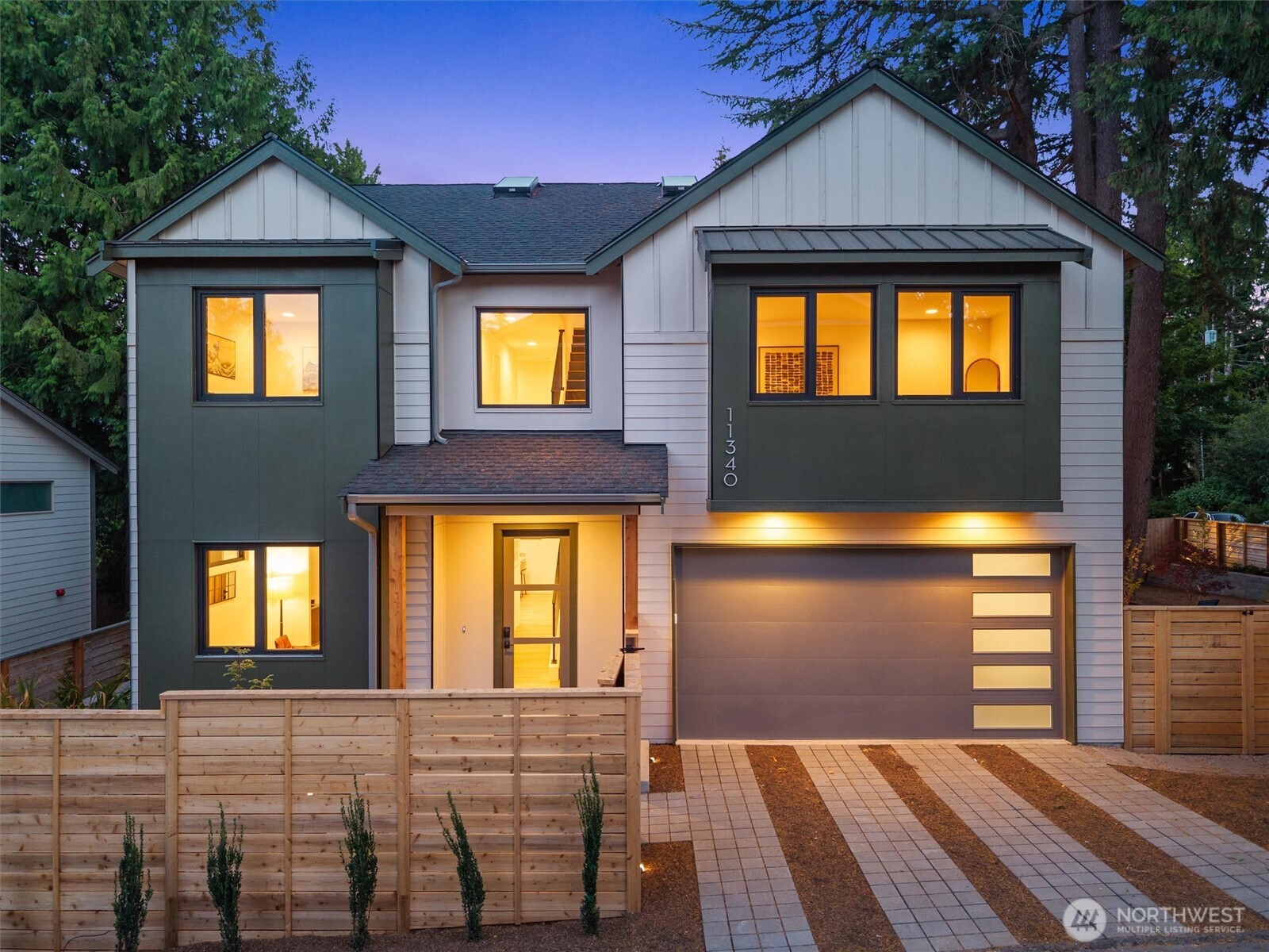 Discover refined modern living by Ava Homes llc. An exceptional new residence in the tucked-away Victory Heights neighborhood. Offering 3,340 square feet of thoughtfully finished living space, this home blends European-inspired design, elevated materials, and flexible spaces designed for everyday comfort and entertaining. The open main floor centers on a chef’s kitchen appointed with premium appliances, Nova Cucina cabinetry, and Bianco Carrara marble countertops imported from Italy. Generous living and dining areas flow naturally to the fully fenced backyard and patio—ideal for indoor-outdoor gatherings. A convenient main-floor ensuite bedroom provides a versatile option for guests, multigenerational living, or a private home office. Upstairs, the spacious primary suite boasts dual closets and a serene retreat-like feel. The second level also includes another ensuite bedroom, a third bedroom, and a large bonus room—all on one floor. The top-level great room offers even more flexibility: create a media lounge, playroom, fitness studio, creative space, or WFH headquarters. Make it your own. A truly wonderful masterpiece by Ava Homes with solid core walnut doors featuring frameless hardware and euro style hinges from noted Italian manufacturer Barausse. Upgraded window package from German manufacturer Gealan featuring tilt and turn style windows. 2-car attached garage with EV. Convenient to Maple Leaf, Hazel Wolf K-8 STEM school, I-5 and Northgate Light Rail. A must see!!