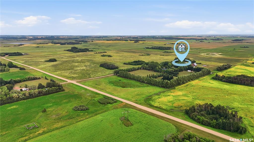 Great opportunity to own 146 acres of productive agricultural land in Corman Park area, just minutes from Saskatoon towards Clavet. Offering an exceptional combination of quality farmland, and a comfortable acreage home, this property provides tremendous flexibility for farmers, equestrian enthusiasts, hobby farmers, and those looking for room to build their future.The 3-bedroom, 2-bathroom home is well maintained and provides comfortable living with plenty of opportunity to make it your own. The property is exceptionally well equipped for a wide variety of agricultural and recreational uses, featuring a large barn, substantial Quonset, two additional smaller barns, and multiple grain bins.The acreage provides excellent space for horses and a variety of animals, with the buildings and layout offering numerous possibilities for agricultural, equestrian, storage, or hobby-farm use. The expansive land component is the true highlight, offering valuable productive farmland in an increasingly sought-after area surrounding Saskatoon.Another significant attraction is the potential to separate the agricultural land from the established residential yard site, subject to Corman Park approval and applicable zoning and subdivision requirements. This creates an exciting opportunity for buyers looking to acquire a beautiful acreage while potentially retaining or separating valuable agricultural land.With its combination of 146 acres, productive farmland, extensive outbuildings, established residence, and proximity to Saskatoon, properties offering this level of land and flexibility are increasingly difficult to find. A rare opportunity to secure substantial agricultural land in one of the most desirable acreage areas surrounding the city.