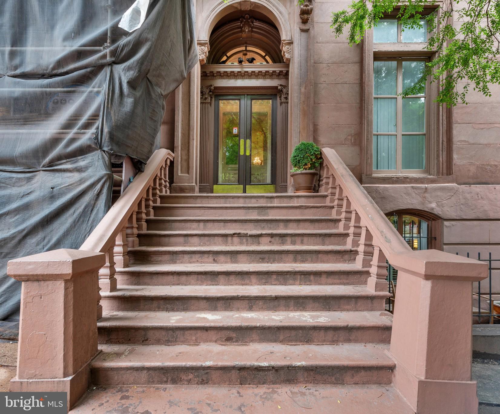 Enjoy sophisticated urban living in this stunning condo in a circa 1850s brownstone mansion just steps from the Washington Monument. Located on a brick-lined street, this two-bedroom, two-bath unit features a wall of windows overlooking a landscaped rear courtyard with views of one of Baltimore's most elegant carriage houses. No detail has been spared--the unit has a spectacular contemporary kitchen, soaring ceilings, tiled baths, a full-sized washer and dryer discreetly hidden behind a sliding mirror, and more than ample storage. Come and see it today, and make this amazing place your own! (Note: $190/mo special assessment ends in October 2026)