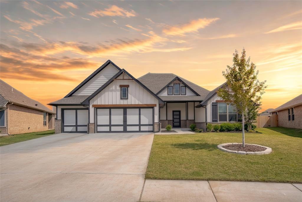 **SELLER OFFERING UP TO $11,892 IN FLEX CASH TOWARD CLOSING COSTS AND/OR AN INTEREST RATE BUY-DOWN.* Absolutely STUNNING newly constructed 5 bedroom, 3 1/2 bath masterpiece in the fabulous Cedar Lane Addition! Nestled in a quiet cul-de-sac just MINUTES from the University of Oklahoma, community pool, playground, TONS of new growth & development and more! An impressive custom build with loads of additional high-end upgrades! A massive lot, beautiful landscaping and covered front porch welcomes you home to impressive split floor plan – complete with cathedral ceiling, bright windows, barn door accent, dazzling fireplace, and wood grain tile flooring throughout. You will LOVE the gorgeous open kitchen concept, complete with large island, deep farm sink, tile backsplash, soft-close drawers, double ovens, and upgraded stainless steel built-in appliances. An inviting primary bedroom suite, featuring vaulted ceiling, and HUGE walk-in closet with seasonal racks and convenient laundry room access. The primary ensuite bath is complete with his & her vanity, large garden soaker tub and walk-in onyx tile shower. Roomy secondary bedrooms, each with tall ceilings and large closets. Well-appointed and spacious secondary bathrooms, and convenient powder bath that’s just perfect for guests. Sit outside and relax under an enormous covered back patio with fireplace and enjoy the oversized private backyard with updated fencing – a great space for kids and pets to run around, or for creating your very own backyard oasis! Keep your family Safe and secure in the HUGE 16–18-person storm shelter, conveniently built in the extended 3-car garage with custom carriage-style doors. Walking distance to the community pool, basketball courts and playground! Just PERFECT for large, growing or blended families looking for a spacious place to call home! * Call for Details!