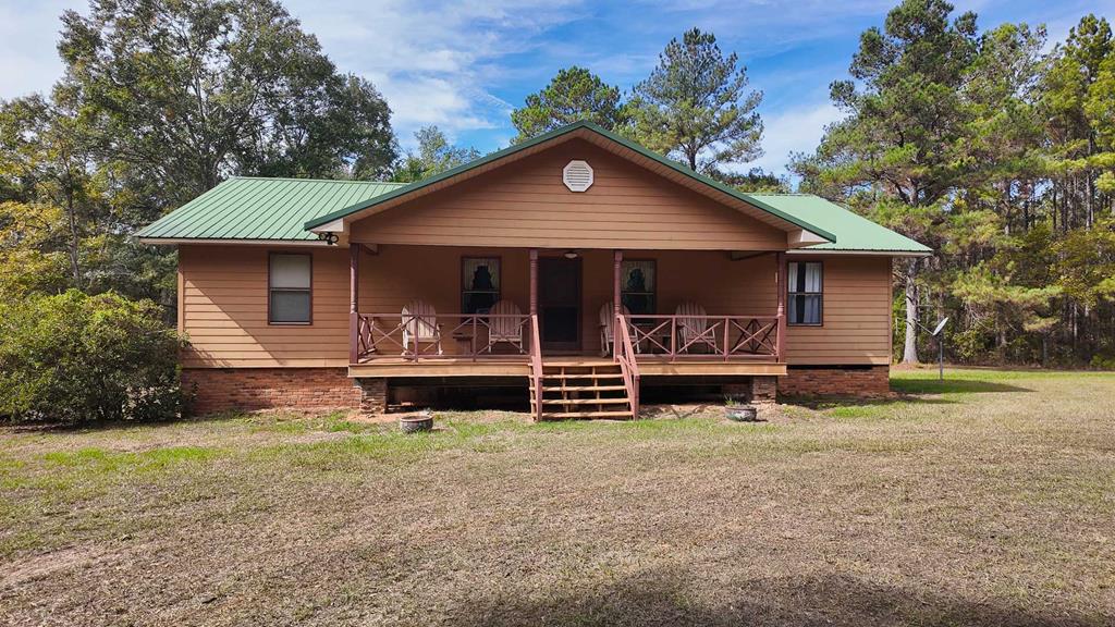 Looking for peace, privacy, and room to roam? This 2-bedroom, 2-bath home sits on nearly 10 beautiful acres surrounded by some of South Georgia's most scenic plantations—just minutes from downtown Boston, GA. Here, you'll enjoy the quiet of the countryside with the charm and convenience of a small town nearby. The home features a durable metal roof, granite countertops, and a spacious master suite with two closets. With a little updating—fresh carpet and a coat of paint—this home could easily be brought back to life and made your own. Outside, the property is fully fenced for horses, offering endless possibilities for country living. Whether you envision a small hobby farm, a peaceful weekend getaway, or simply your own private retreat, this property provides the space and serenity you've been searching for. Experience the best of quiet country life while staying close to everything you need—this one is a rare find!