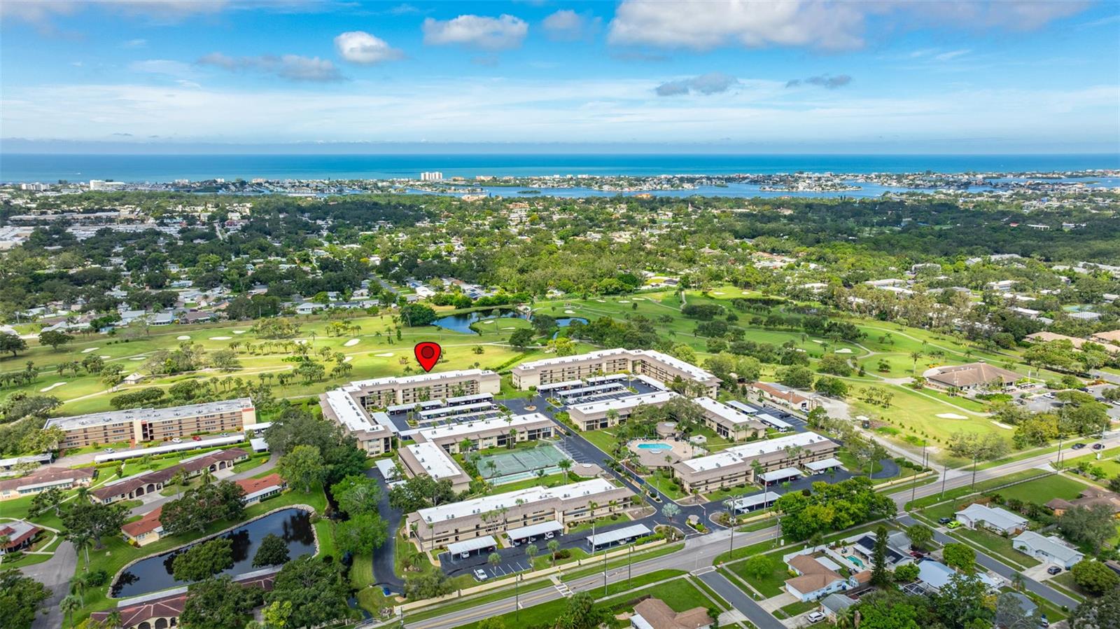 Welcome to Villas de Golf, a community where retirement living meets relaxation right beside the scenic Largo Executive Golf Course. Just two miles from the sugar-sand shores of Indian Rocks Beach, this vibrant 55+ community blends leisure with recreation in the best Florida fashion.

This first-floor 2-bedroom, 2-bathroom condo offers over 1,000 sq. ft. of comfortable living, with a carport just steps from the front door. Pride of ownership is clear throughout this well-maintained home. The kitchen features a spacious passthrough to the dining and living room, making entertaining effortless. An enclosed sunroom overlooks the picturesque fairway, with lush shrubbery adding extra privacy. The owner’s suite enjoys direct access to the sunroom, a walk-in closet, and its own ensuite bath. With a split bedroom design, the second bedroom also has a private ensuite—ideal for hosting guests.

At Villas de Golf, every day feels like a getaway. Residents enjoy a wealth of amenities, including a heated pool, tennis, pickleball, and shuffleboard courts, plus two clubhouses—one with billiards, TVs, and gathering spaces, and another with a banquet hall and full kitchen for events. HOA fees cover water, sewer, trash, exterior maintenance, cable TV, and internet, allowing for stress-free living. For added flexibility, rentals are permitted after one year of ownership with a minimum six-month lease. (Sorry, no pets.)

The location is unbeatable—close to the SW Largo Recreation Center, grocery stores, shopping, restaurants, Tampa Bay sporting events, airports, bus stops, and the beautiful Florida Botanical Gardens.

Embrace maintenance-free living at Villas de Golf—bring your clubs, settle in, and enjoy the ultimate retirement lifestyle!