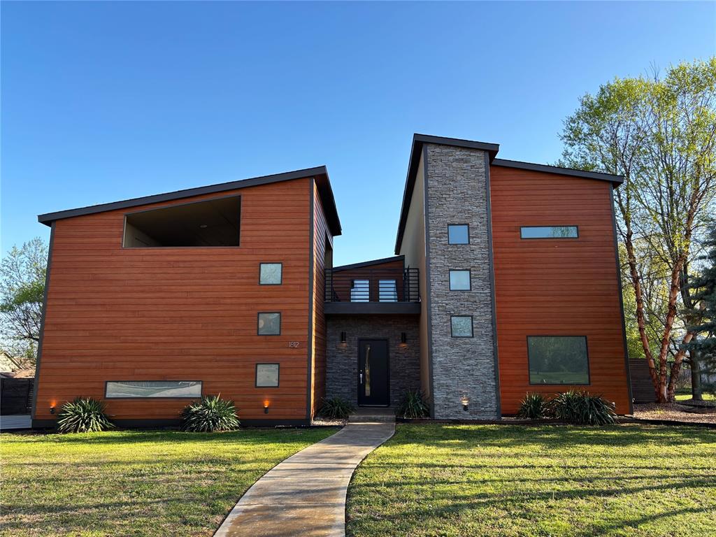 One of a kind home with great features you rarely see! Open and unique floor plan with Brazilian Oak wood floors upstairs & down, super high ceilings with giant ceiling fan, special windows, one of a kind Primary Bathtub, pocket doors, gas cooktop, beautiful kitchen tile and surround sound in multiple locations including upstairs Bonus Room with kitchen set up. Cozy courtyard has fire pit & plenty of room to relax & enjoy your outside art or water features. Large upstairs covered outside deck with tv set up is perfect for entertaining. Additional extras include full sprinkler system, special fiber cement siding, tankless water heater, spray foam insulation for superior efficiency and new roof in 2024 with 20 year transferable warranty. Super quiet end of cul-de-sac lot with Parks and walking trails nearby.